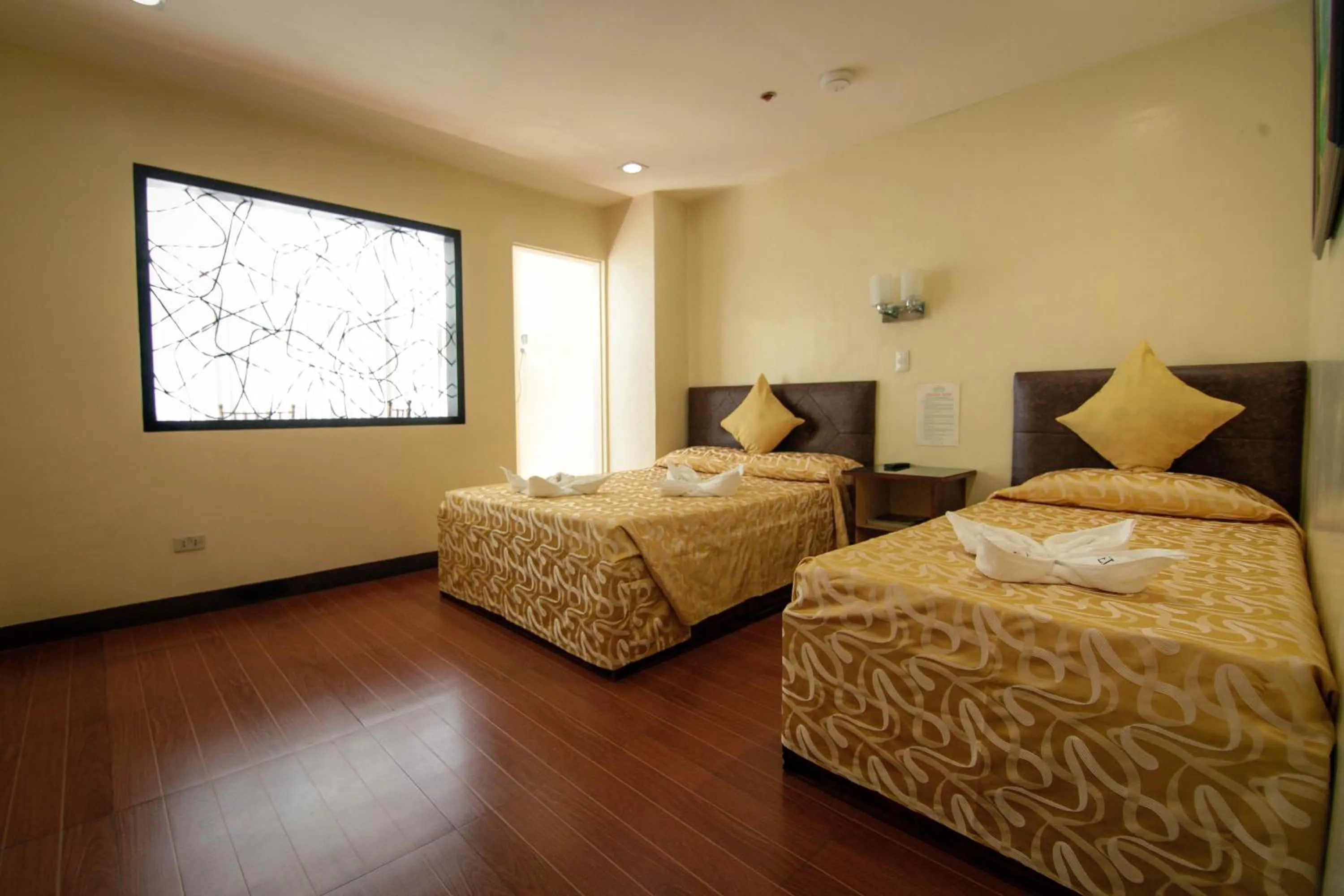 Bed in Fj Manila Hotel