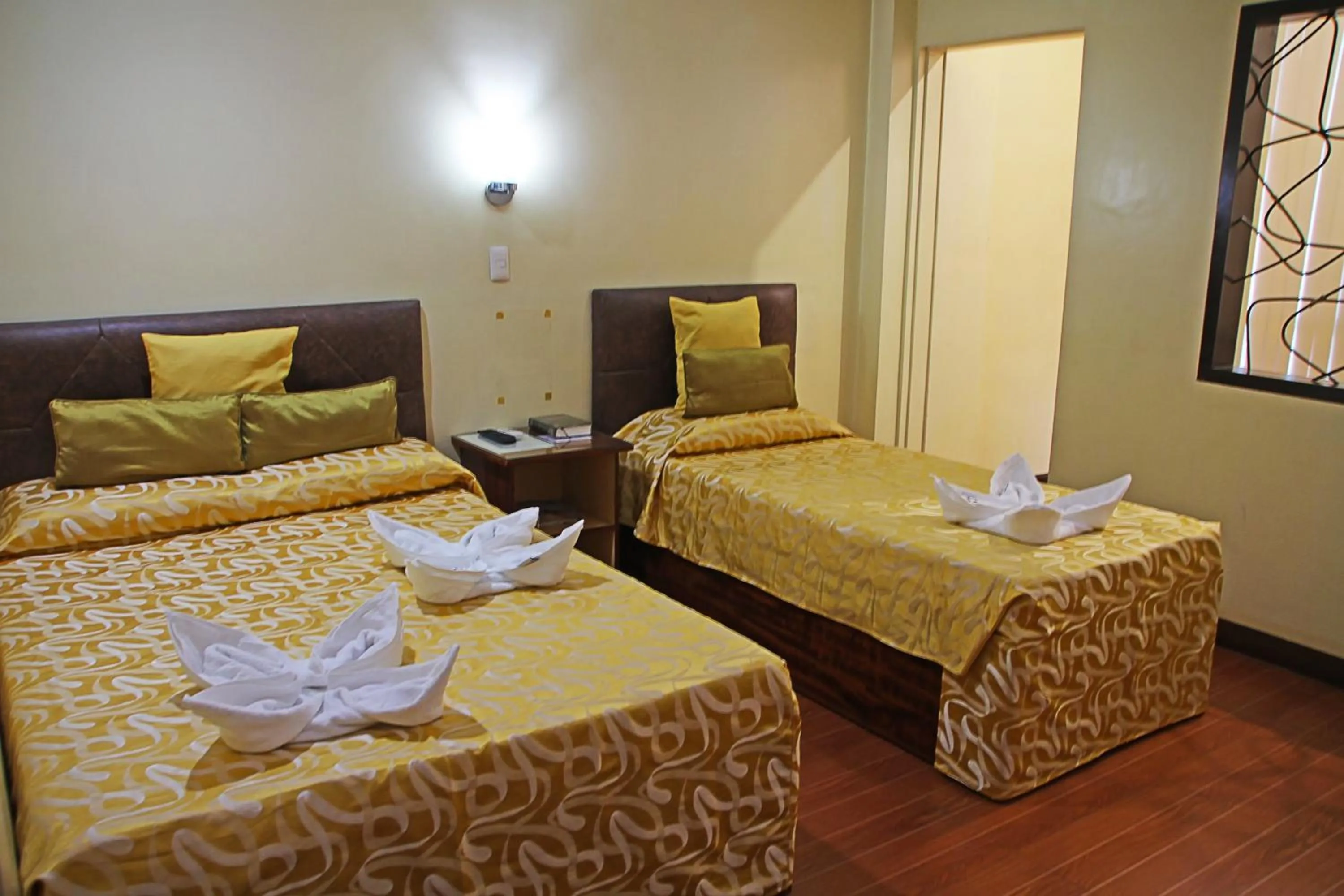 Bed in Fj Manila Hotel