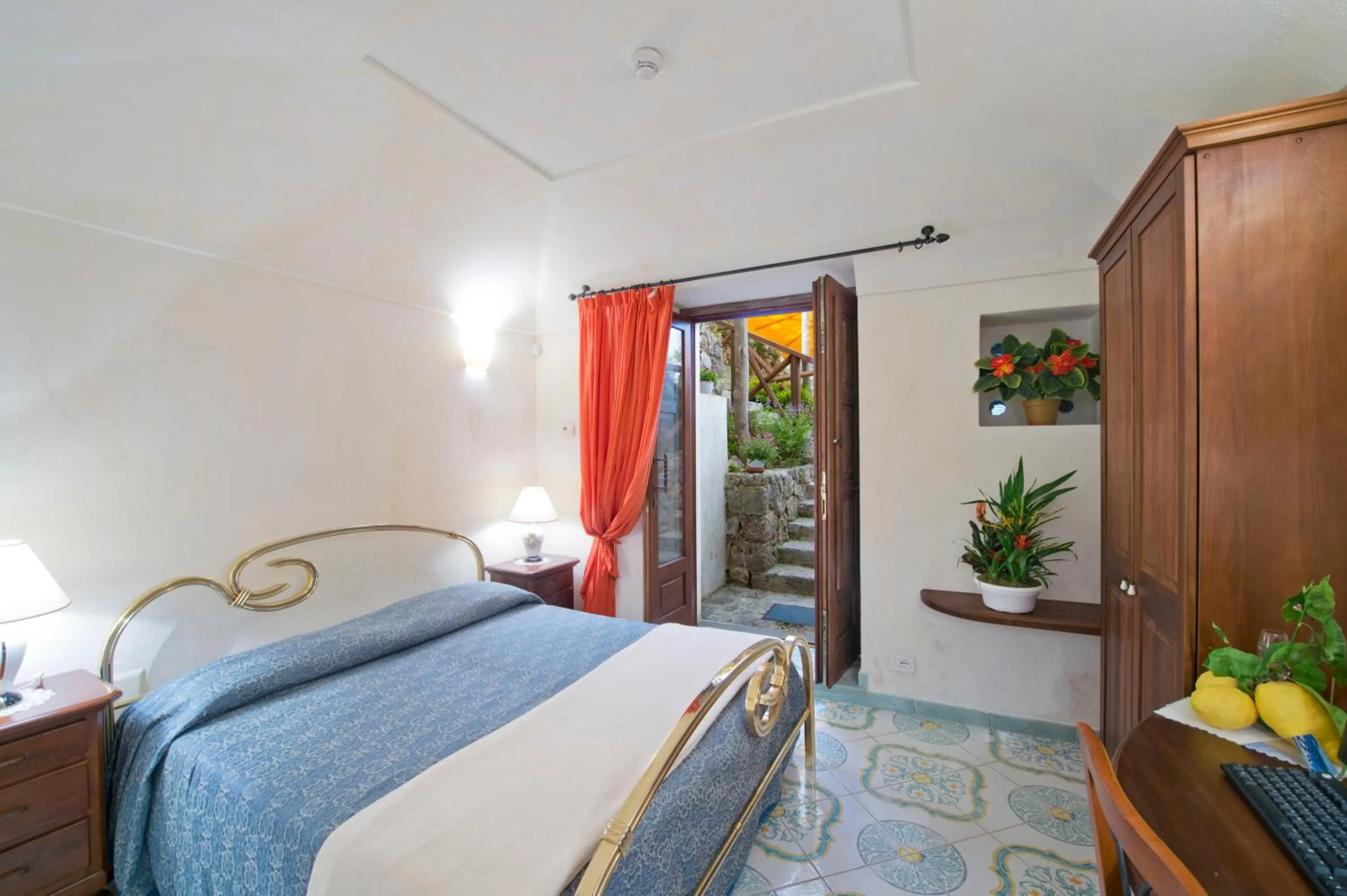 Photo of the whole room, Bed in L'Antico Borgo Dei Limoni