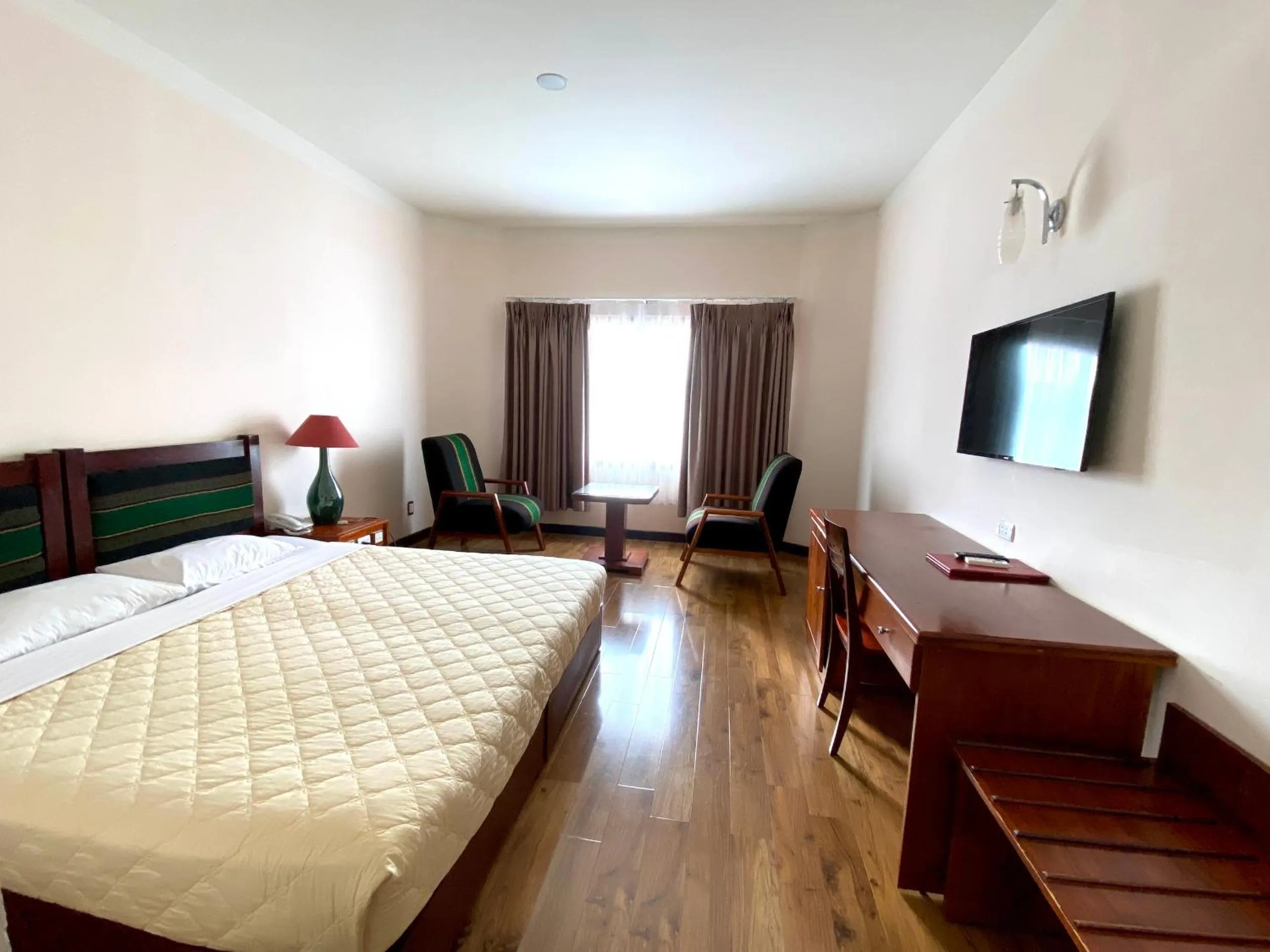 Bed in Dam San Hotel