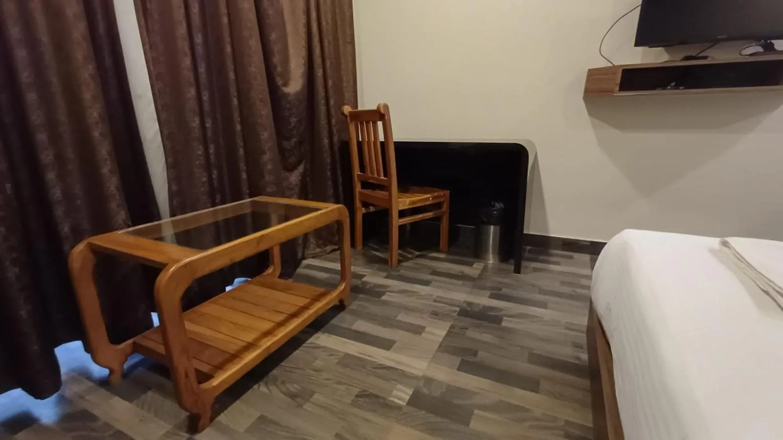 Seating area, Bed in Hotel Sriram JB Residency