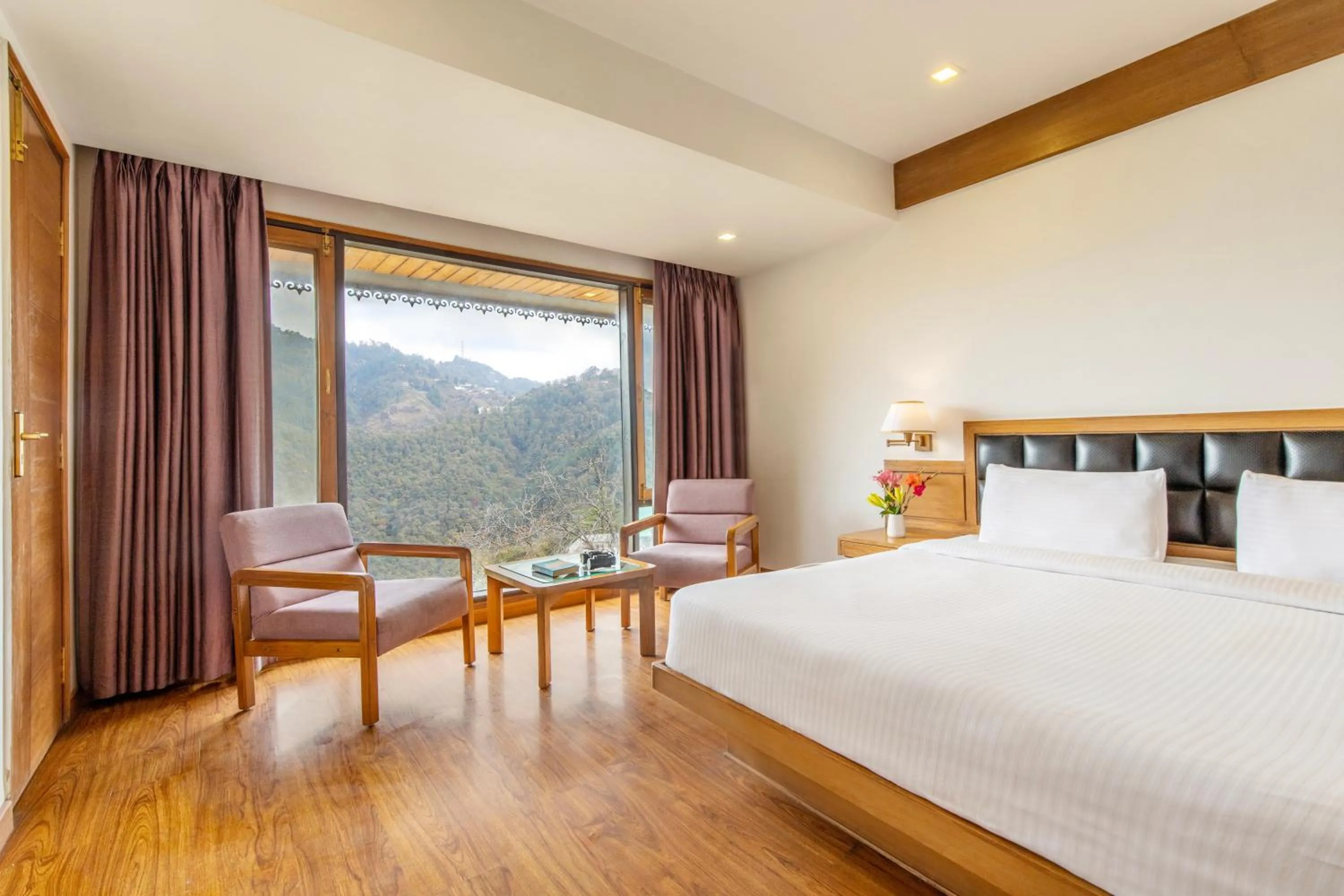 Bedroom, Bed in Country Inn Premier Pacific Mall Road Mussoorie