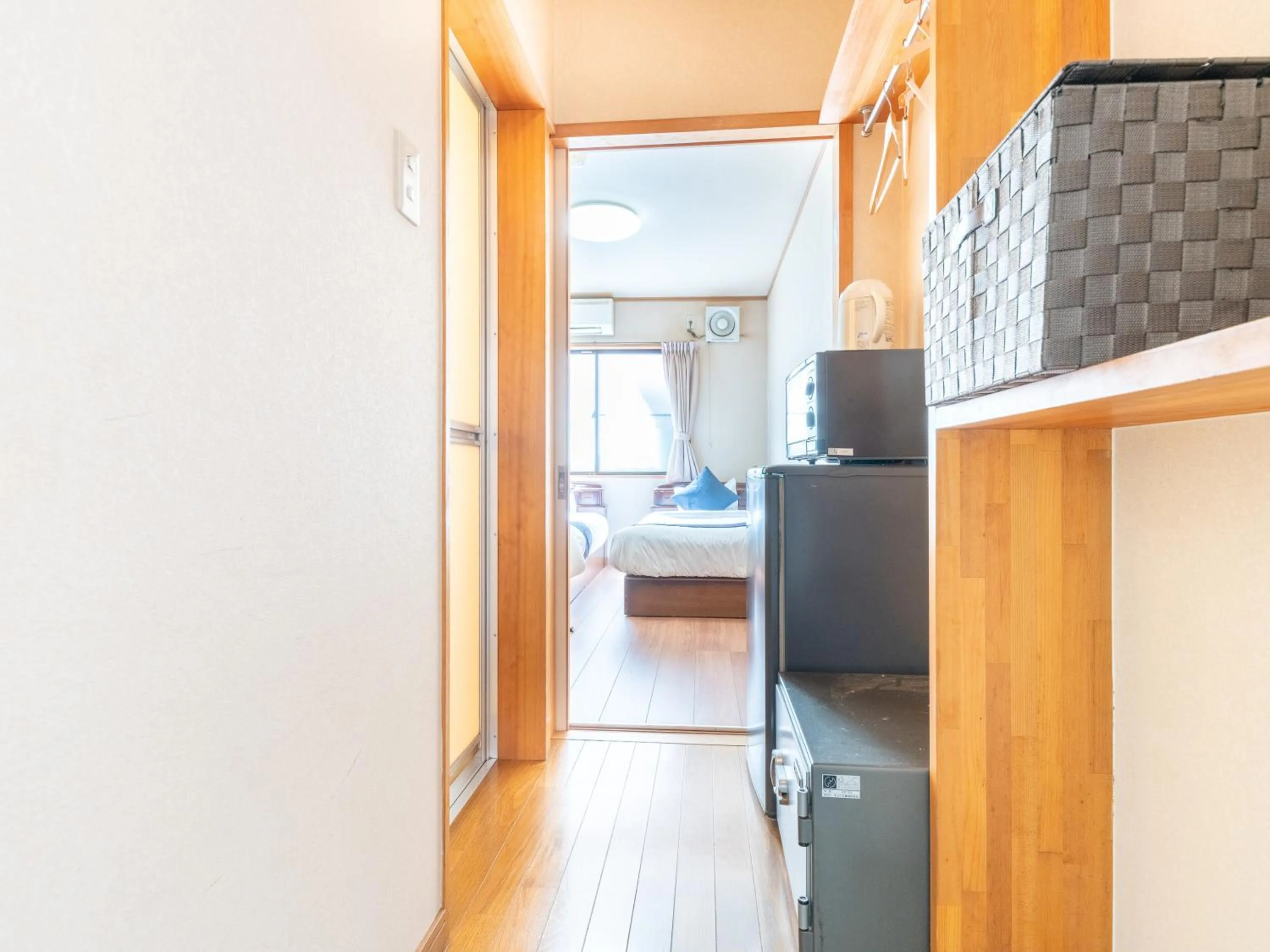 Bed in Tabist Tatsumi Business Hotel Matsusaka