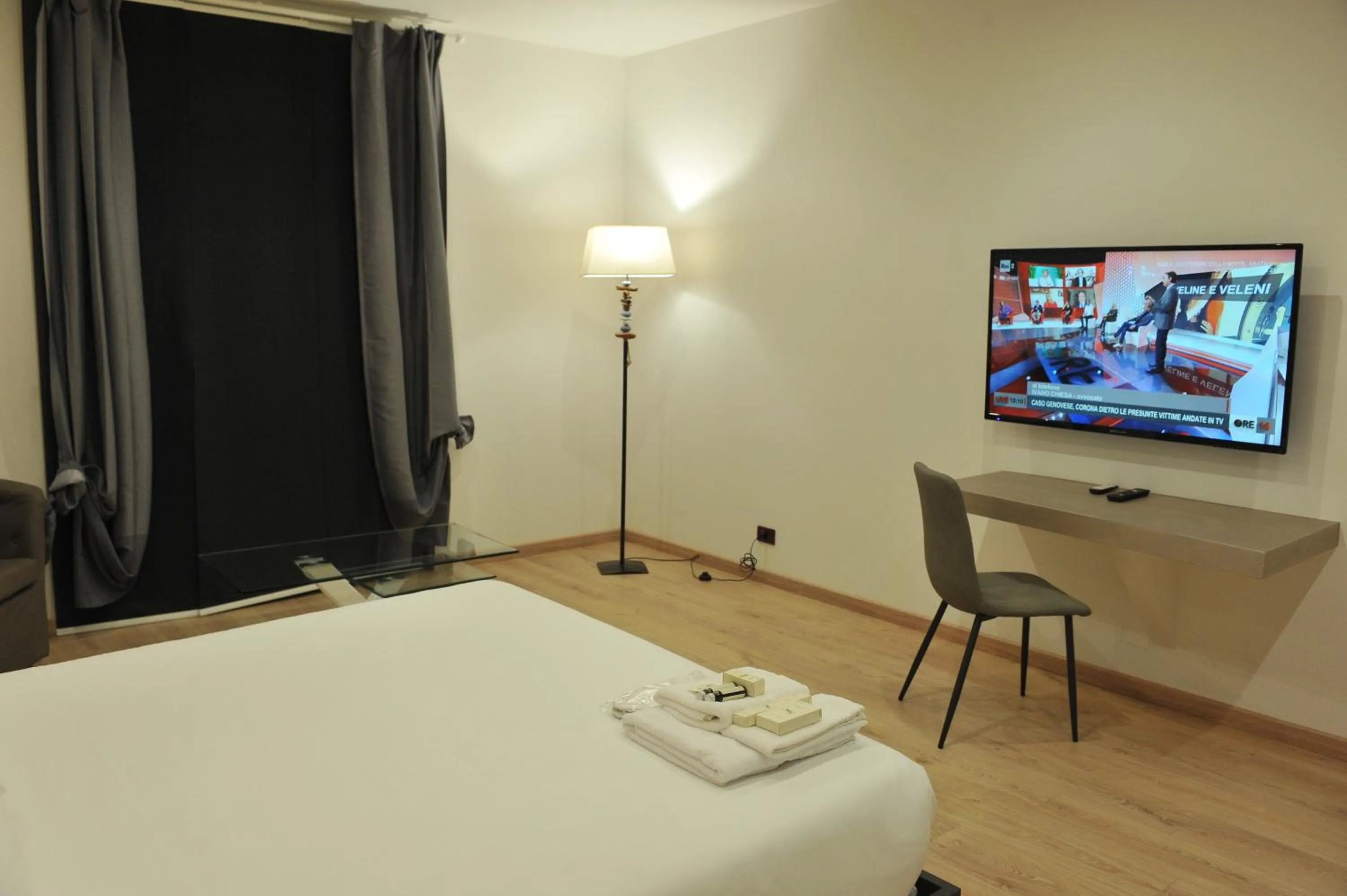 Communal lounge/ TV room, Bed in Hotel Theotokos