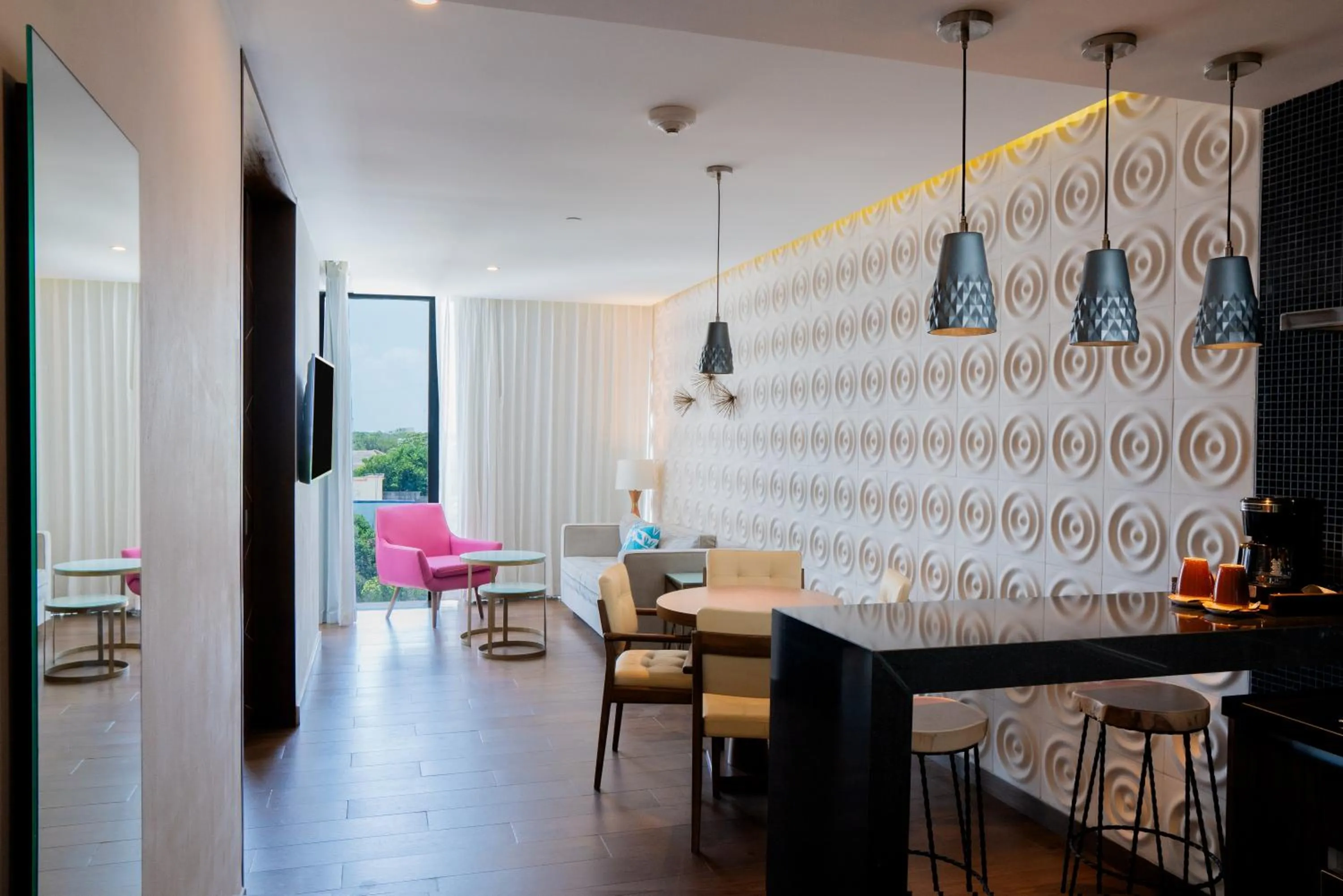 Living room in The Fives Downtown Hotel & Residences, Curio Collection by Hilton