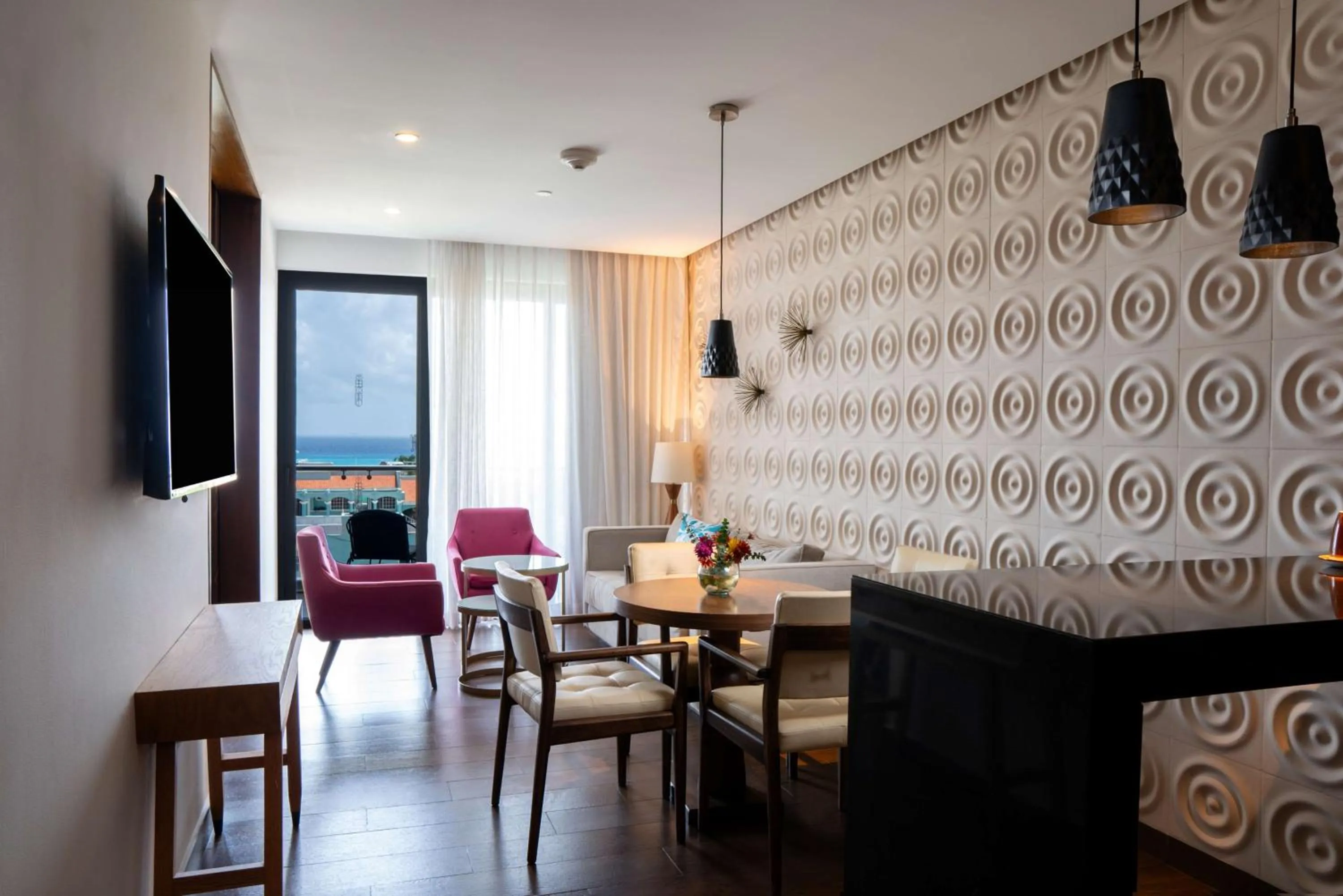 Living room in The Fives Downtown Hotel & Residences, Curio Collection by Hilton