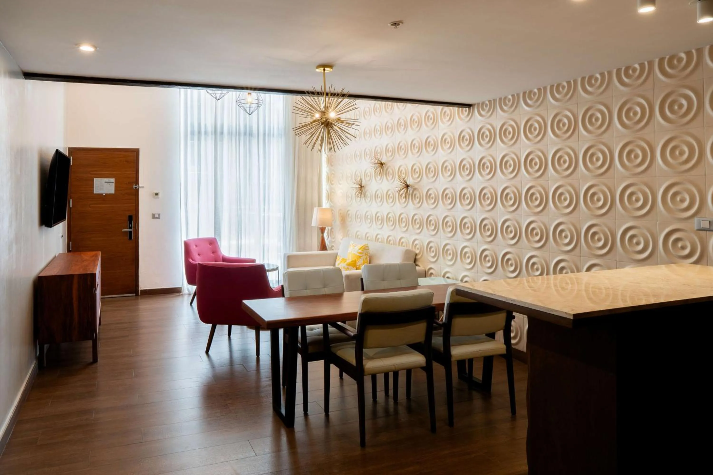 Living room in The Fives Downtown Hotel & Residences, Curio Collection by Hilton