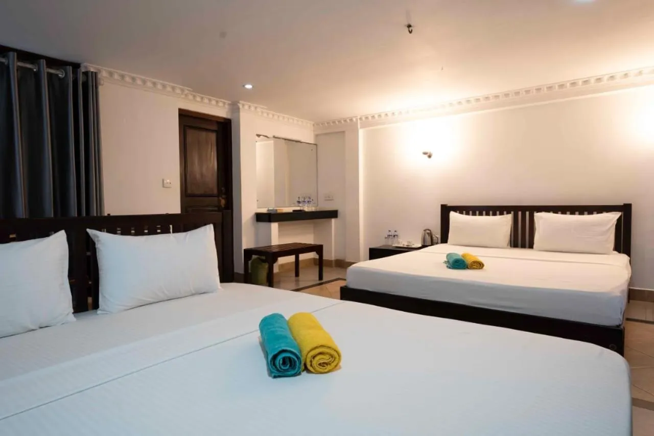 Bed in Topaz Beach Hotel