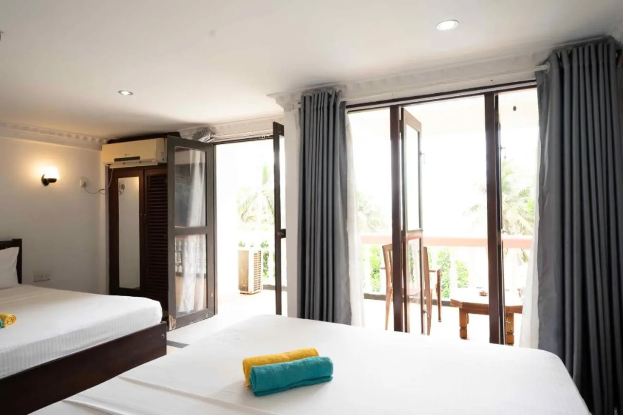 Bed in Topaz Beach Hotel