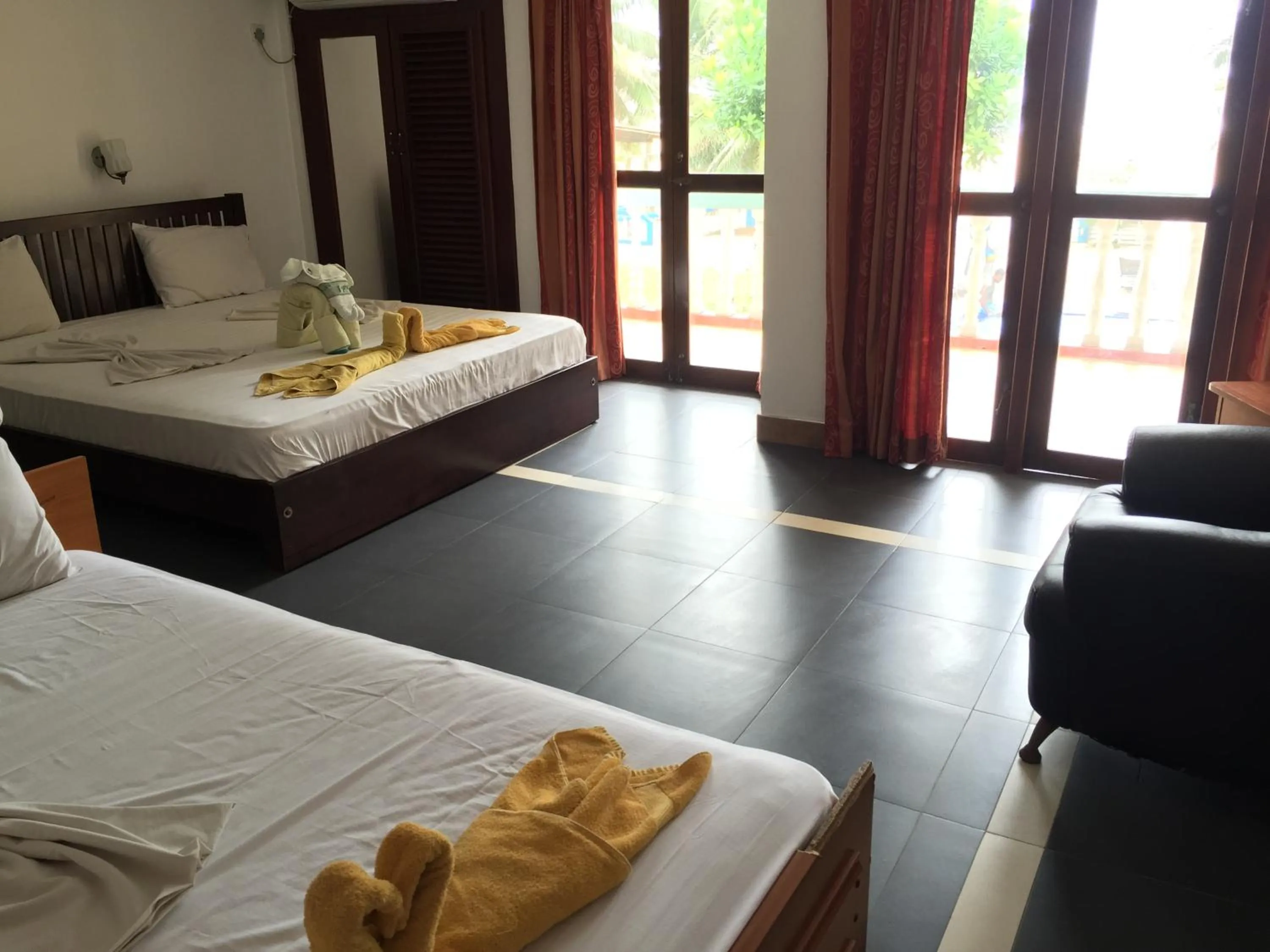 Bed in Topaz Beach Hotel