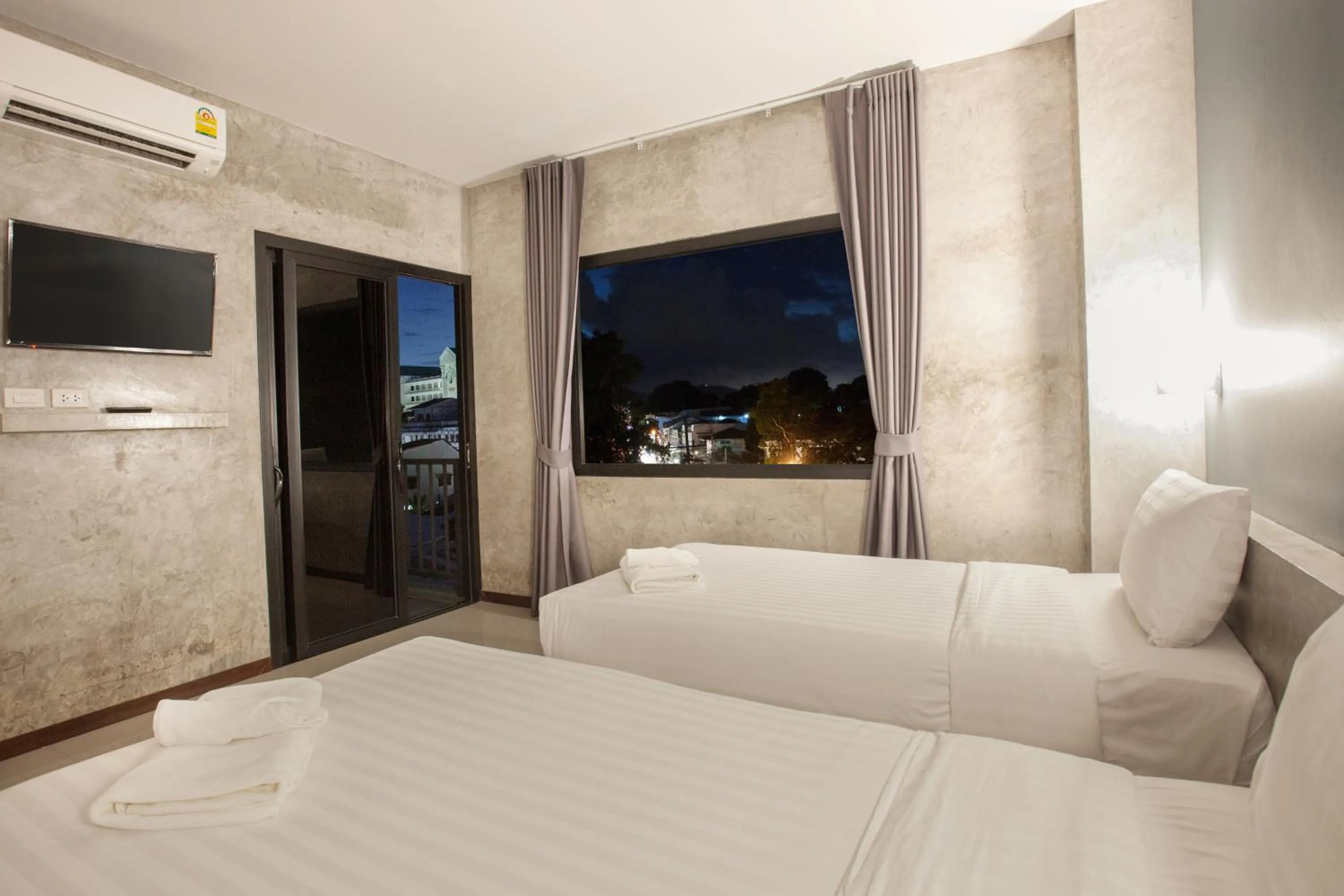 Bed in Ritsurin Boutique Hotel - โรงแรมริทสุริน บูติค