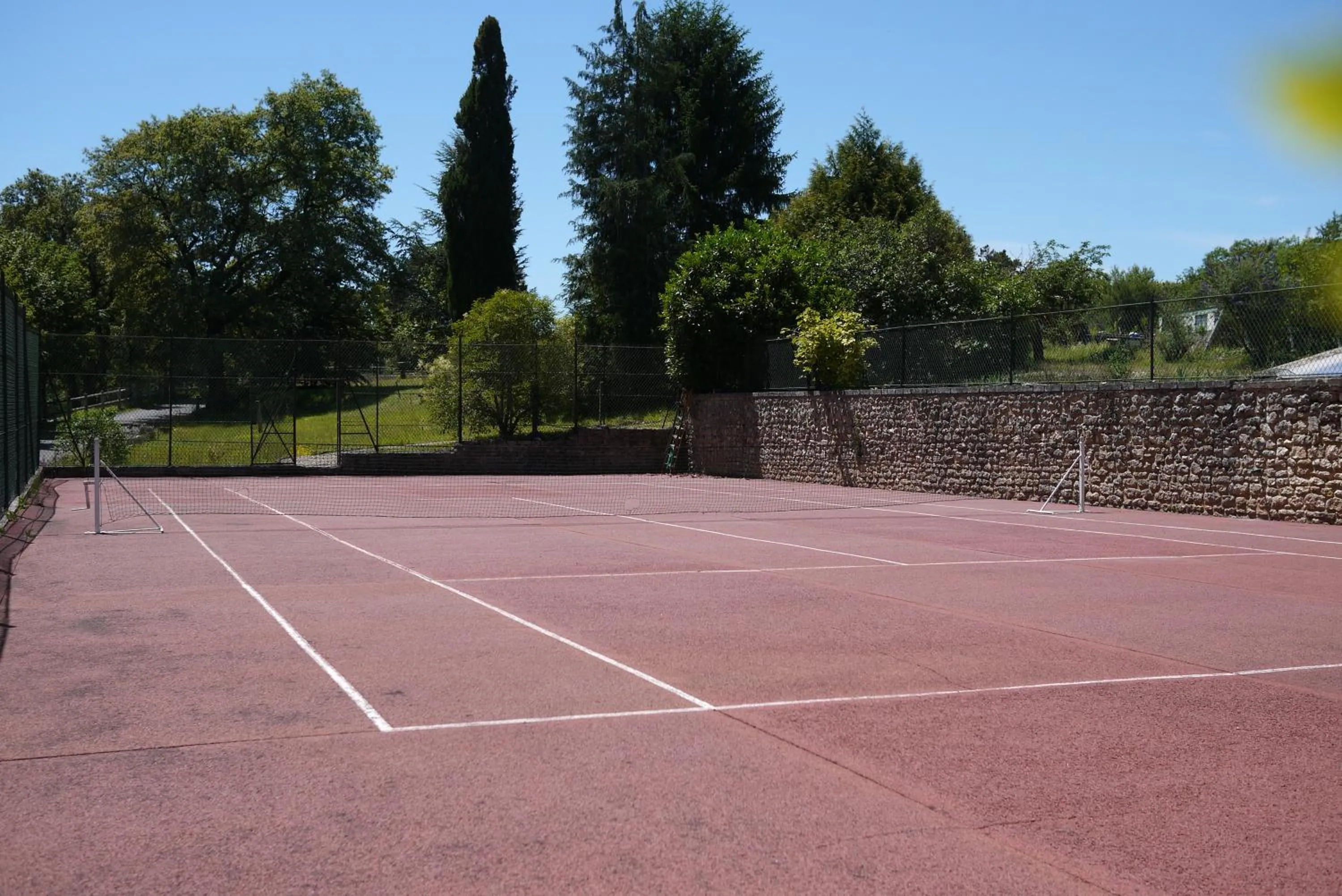 Tennis court in Logis Hotels Domaine du Châtelard
