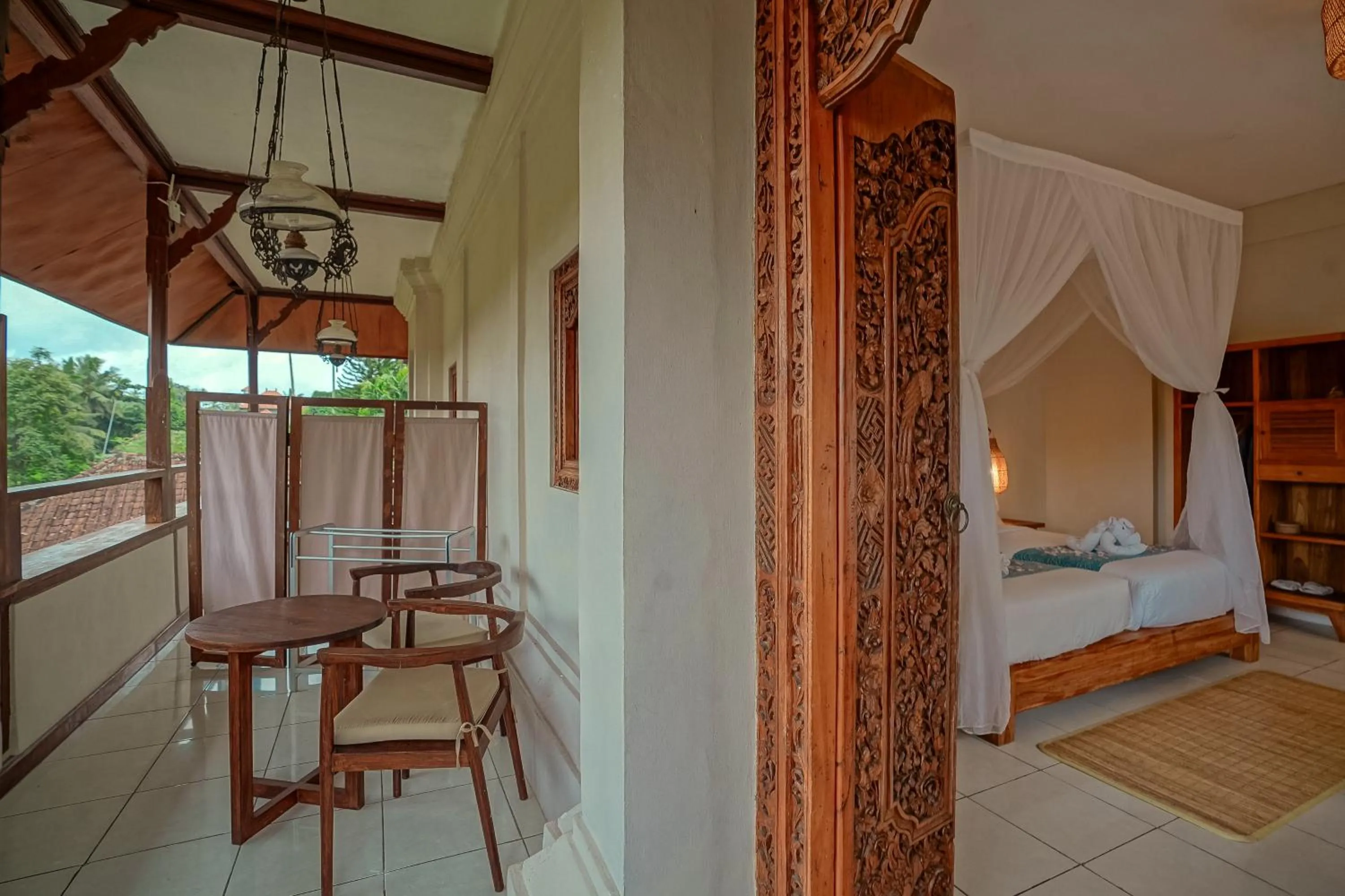 Balcony/Terrace, Bed in Pertiwi Resort & Spa