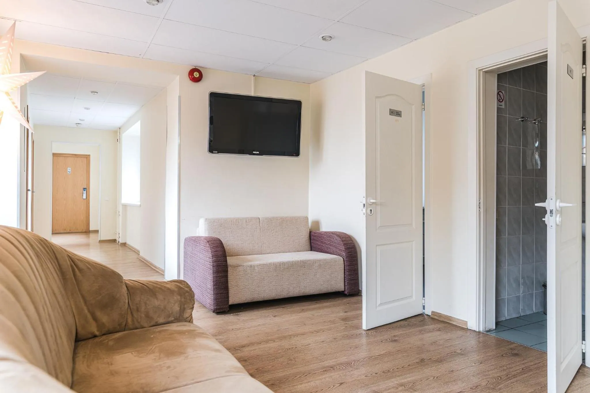 Communal lounge/ TV room in Liva Hotel