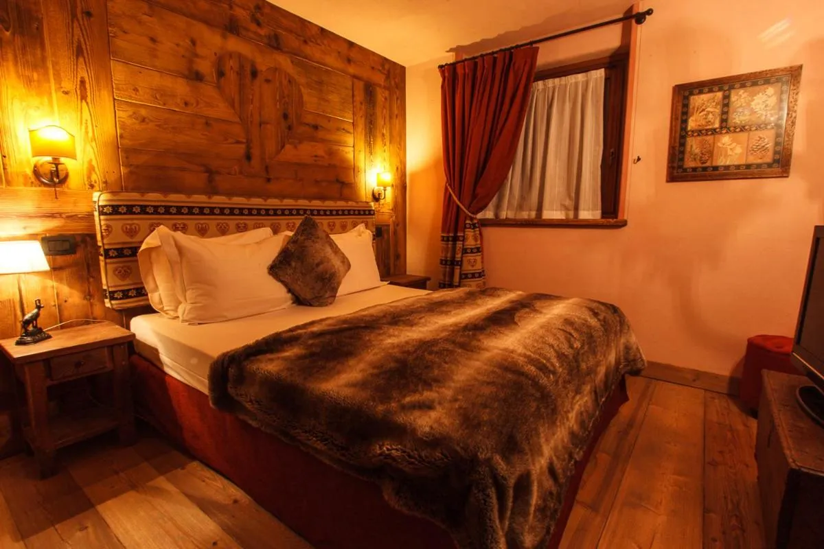 Bed in Au Coeur Des Neiges Resort SPA & FREE E-BIKE
