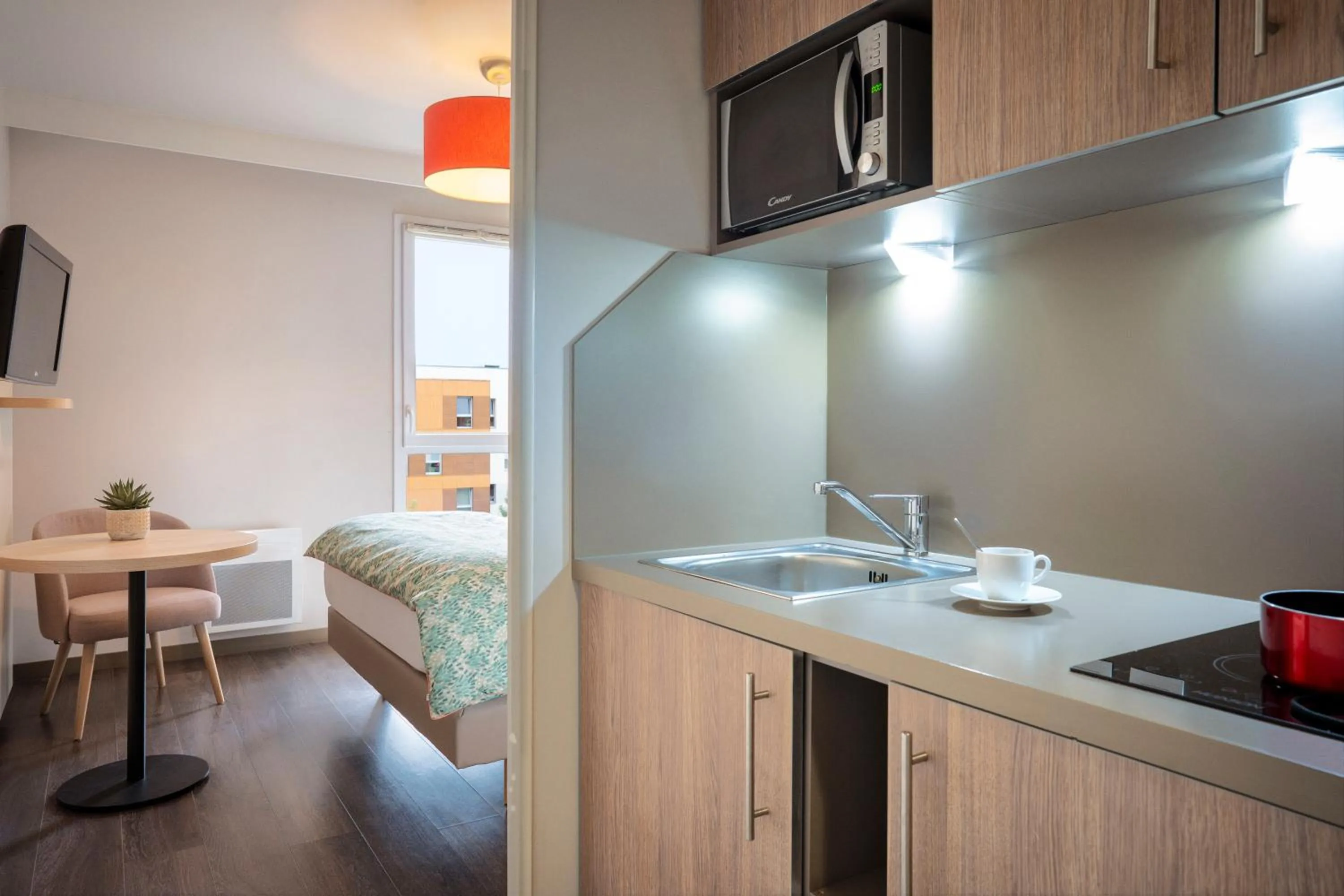 kitchen, Bed in Residhome Paris-Guyancourt