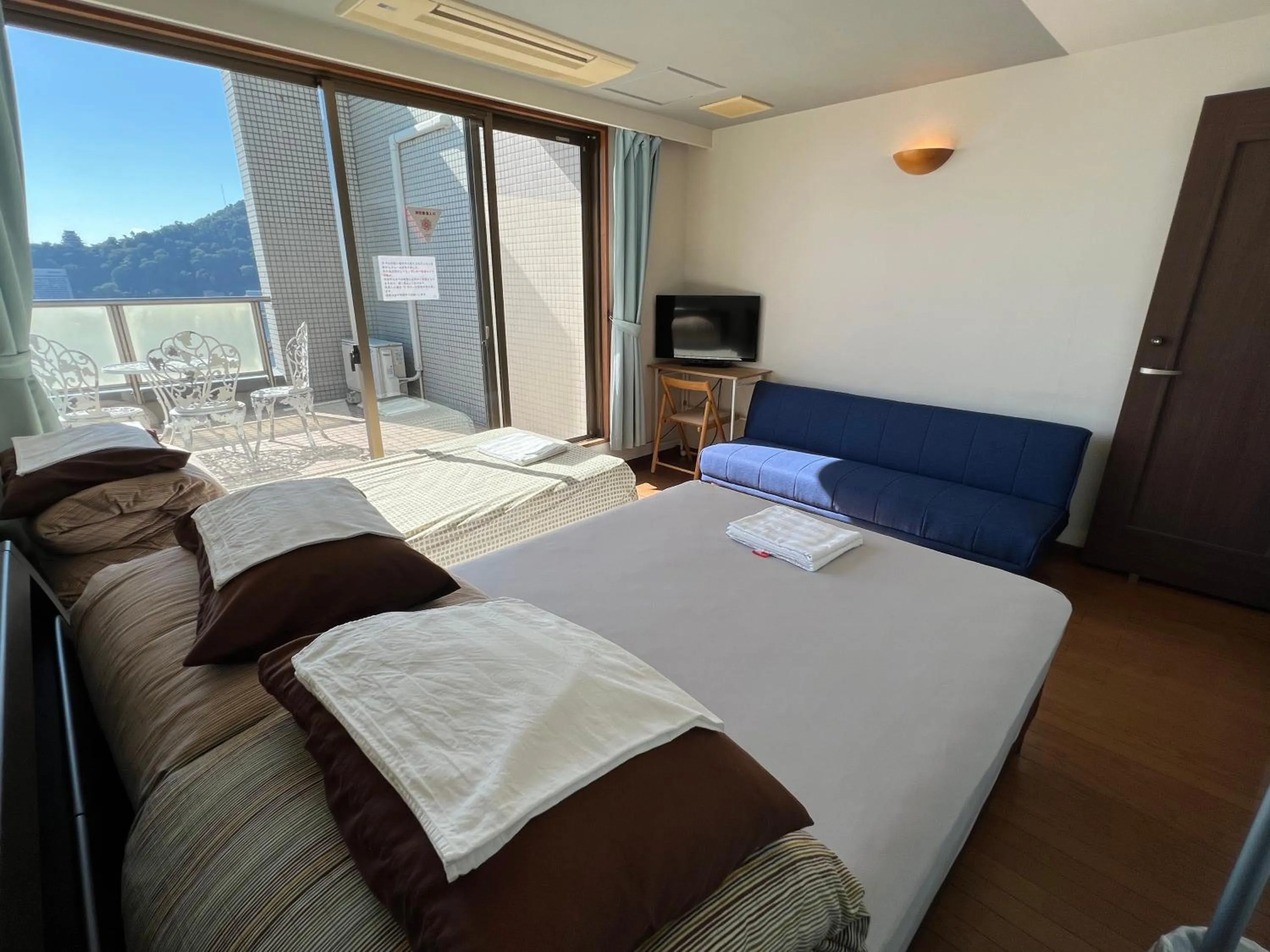 Bed in Atami Onsen Guest House Megumi 5 minutes walk from Atami Station