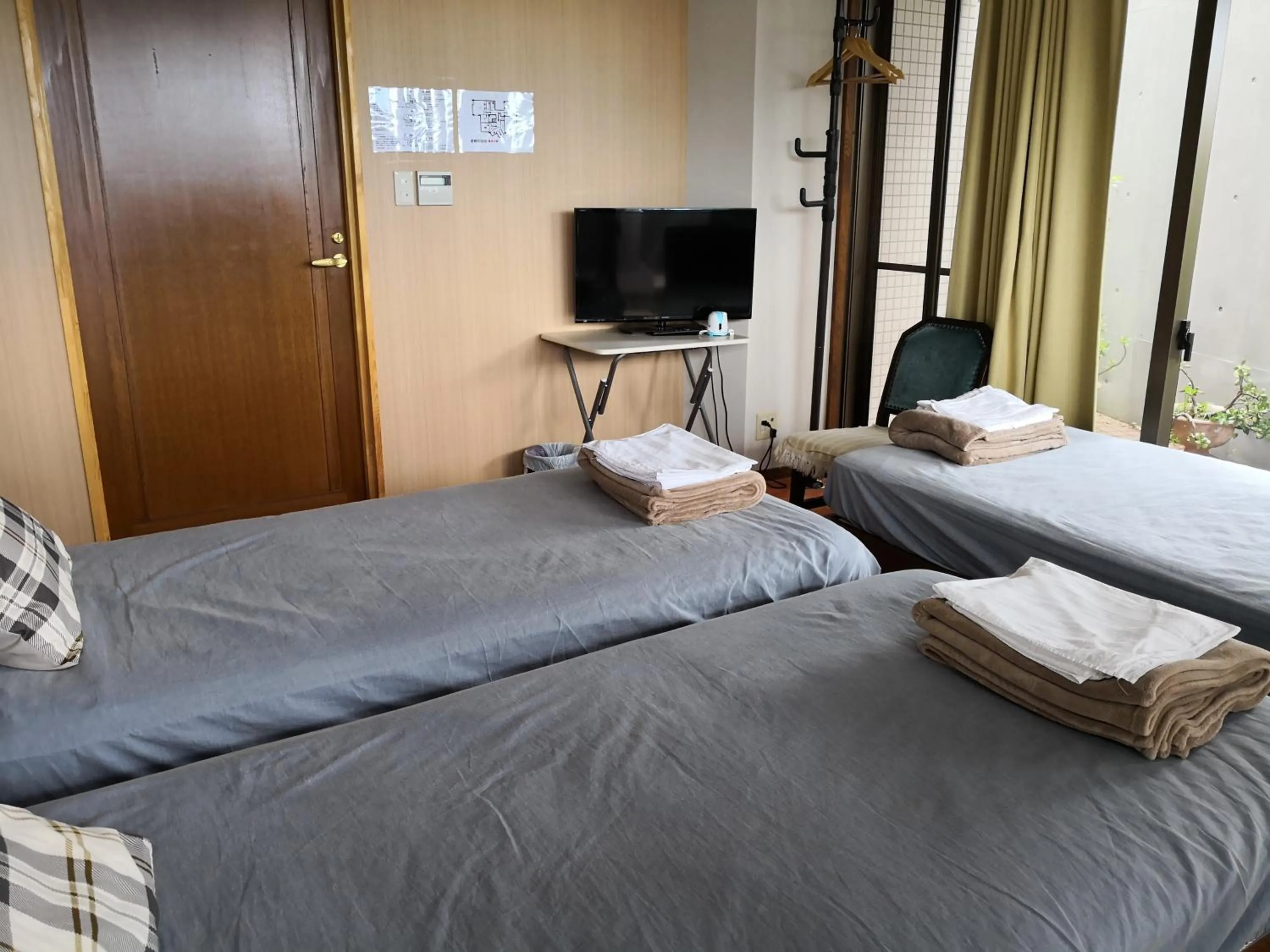 Bed in Atami Onsen Guest House Megumi 5 minutes walk from Atami Station