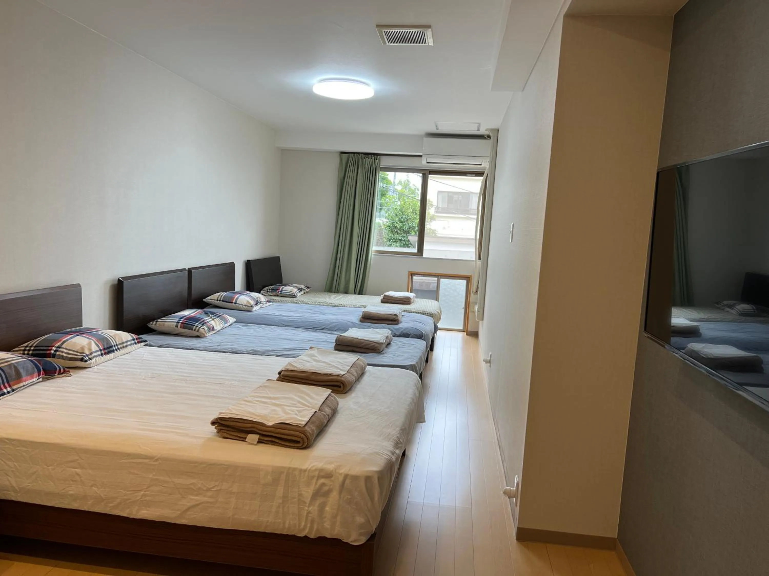 Bed in Atami Onsen Guest House Megumi 5 minutes walk from Atami Station
