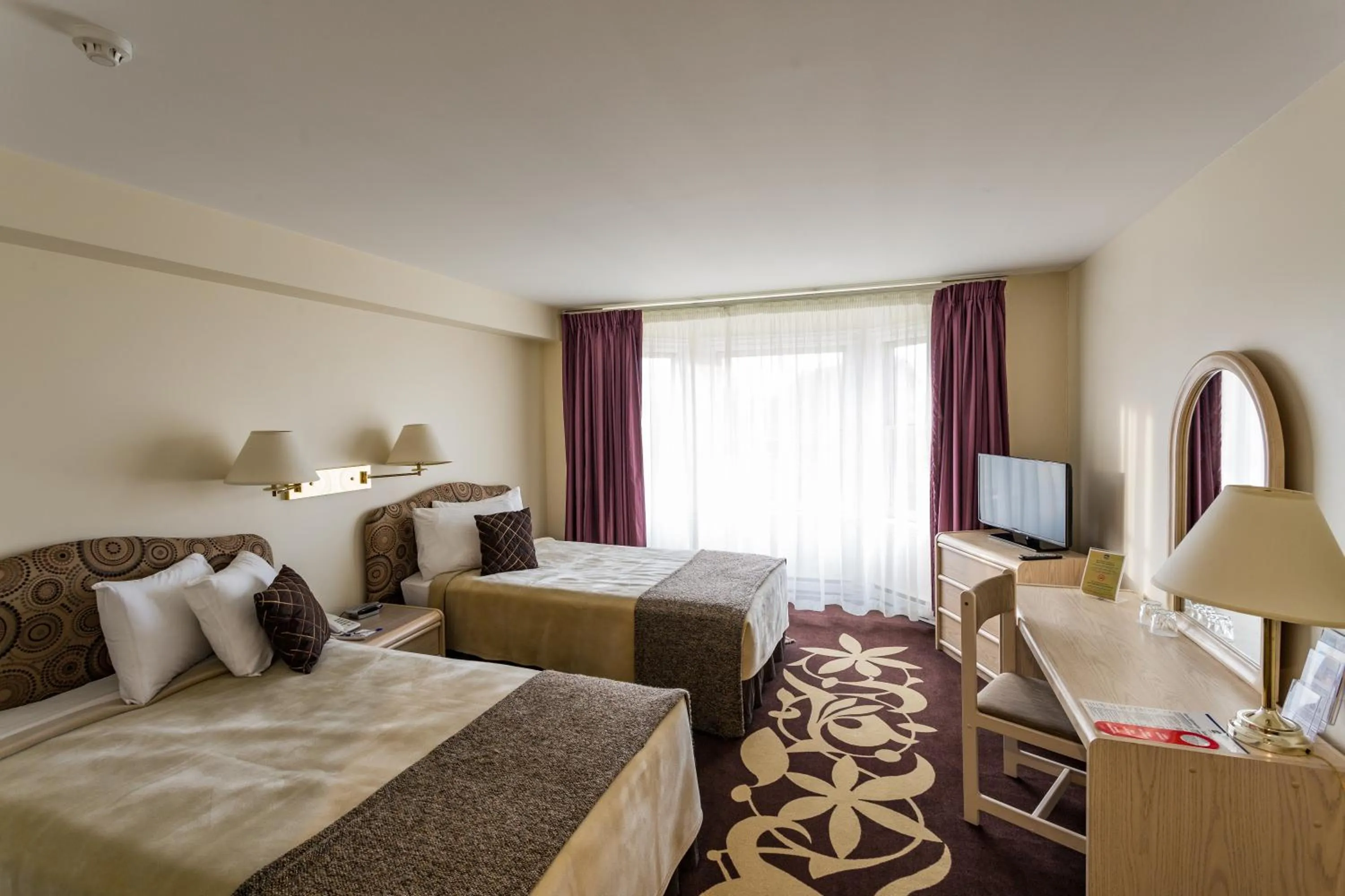 Bed in Airport Hotel Mara