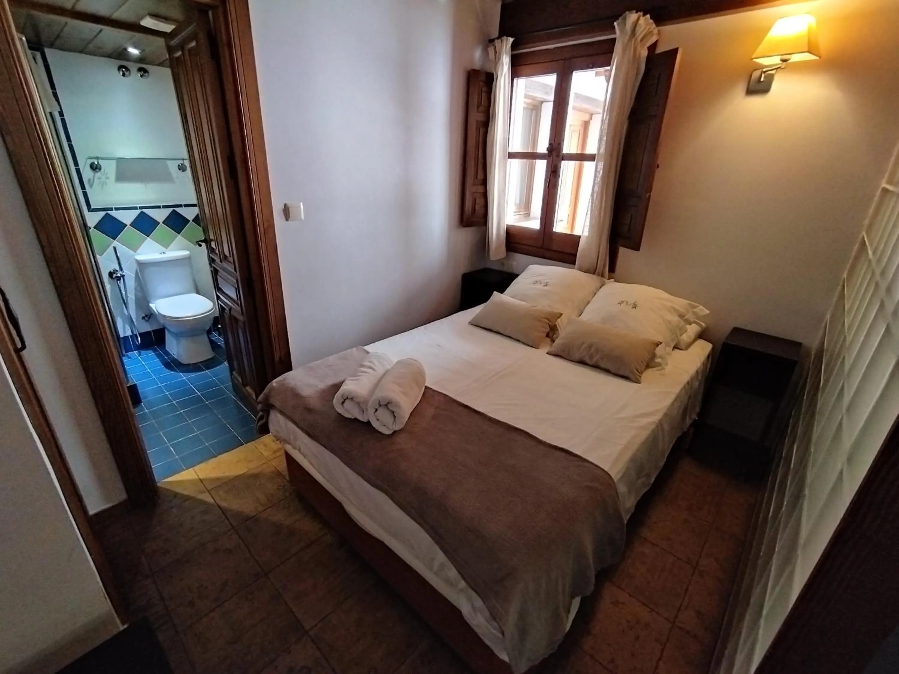 Bed in Apartamentos Alhambra