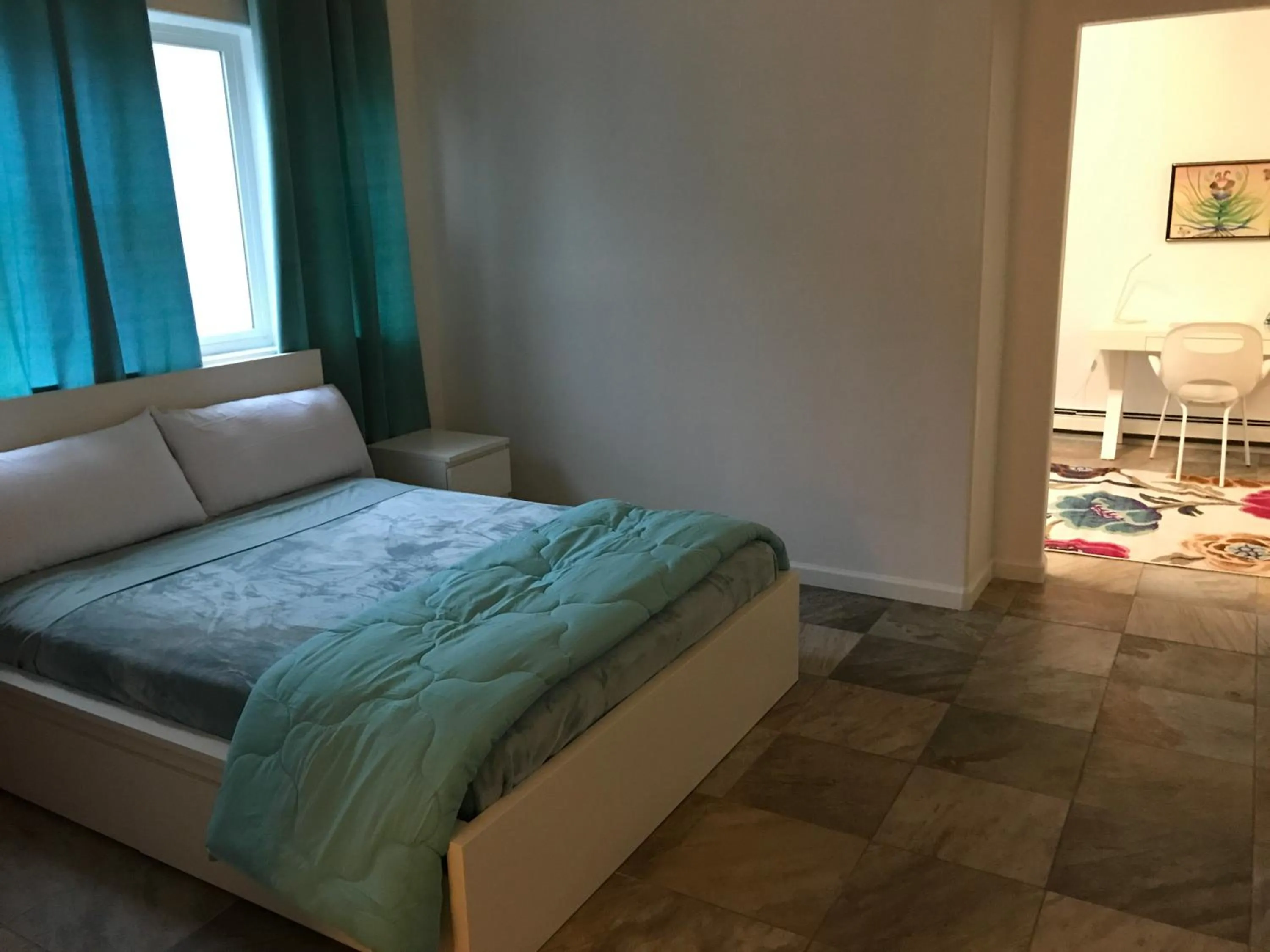 Bed in Aquamarine Suites