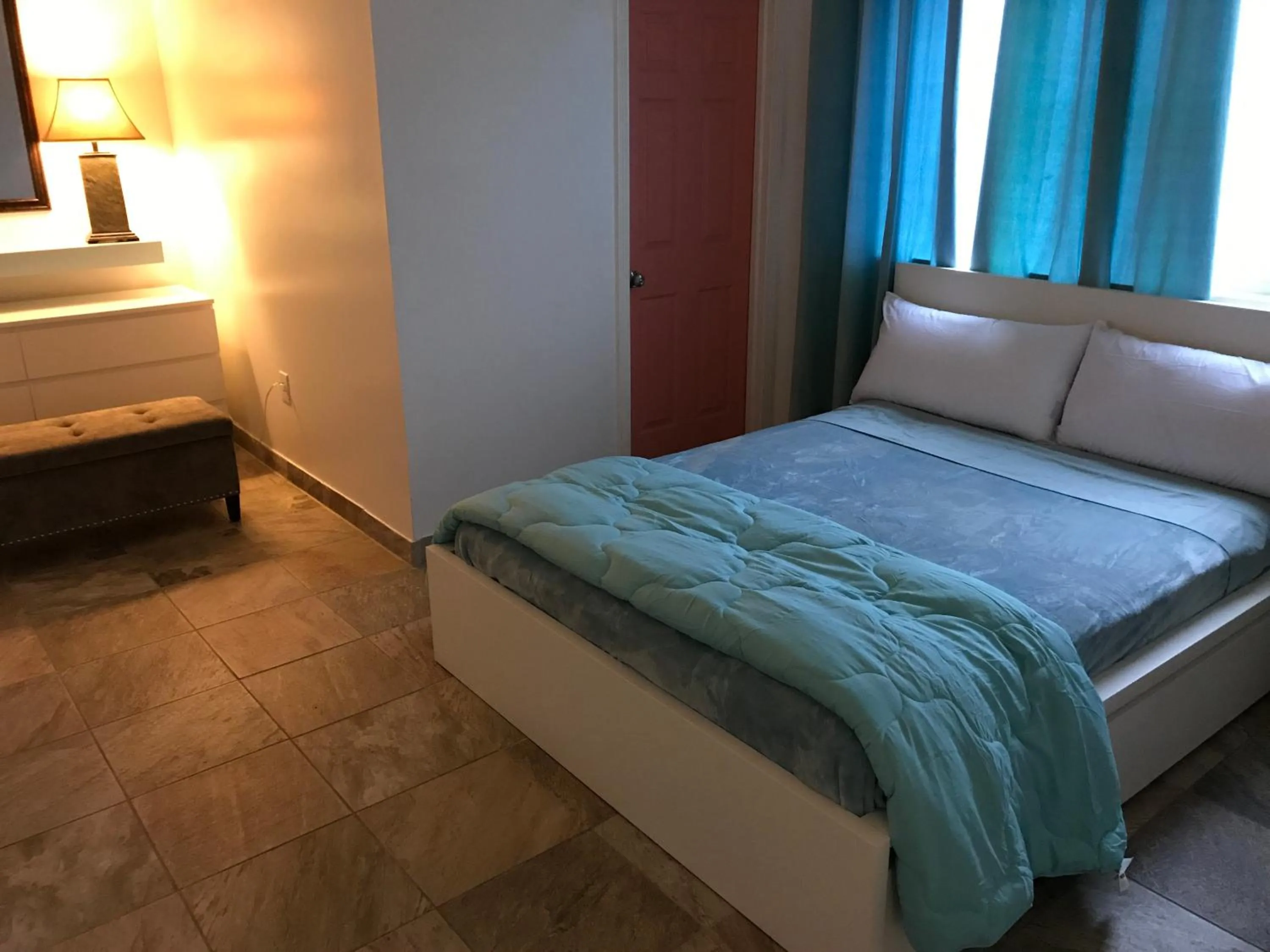 Bed in Aquamarine Suites