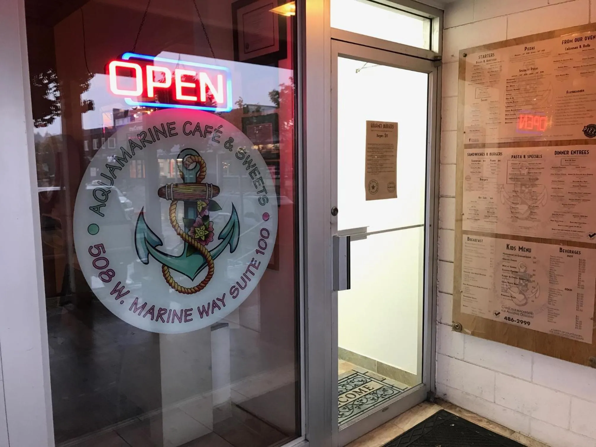 Property logo or sign in Aquamarine Suites