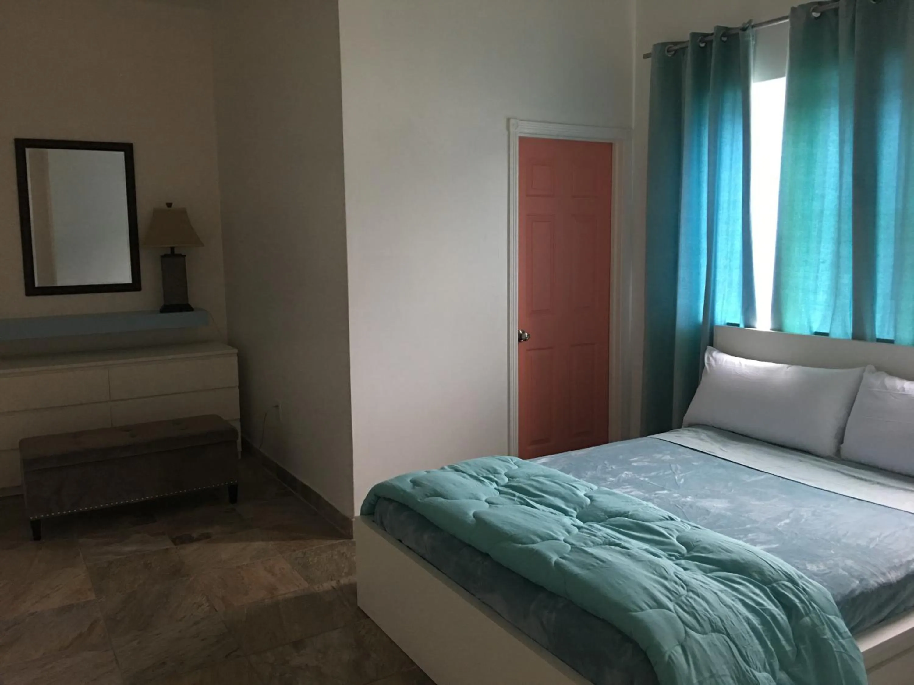 Bed in Aquamarine Suites