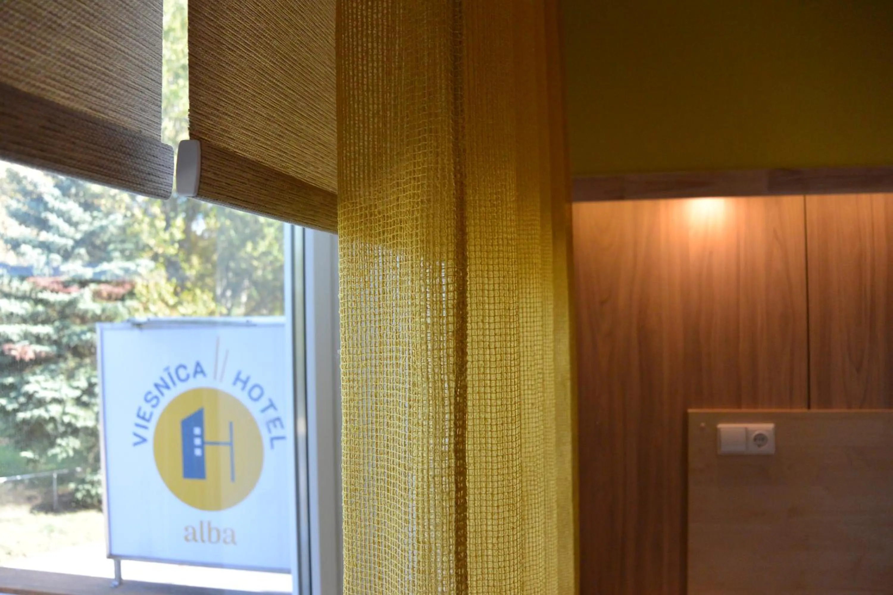 Property logo or sign in Alba Hotel