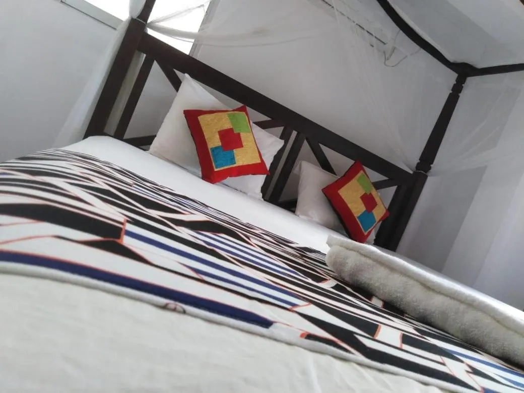 Bed in Blue Horizon Beach Hotel