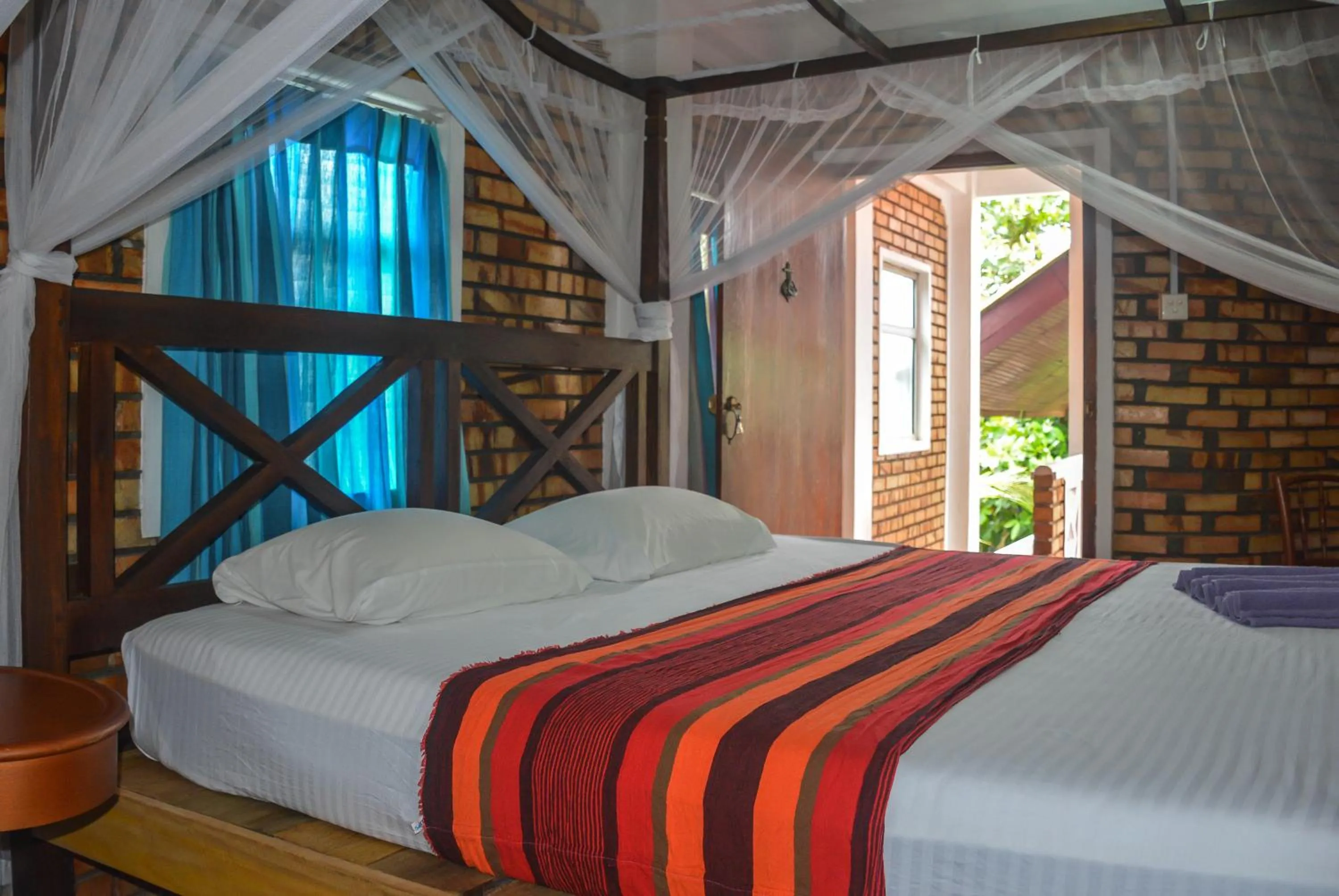 Bed in Blue Horizon Beach Hotel