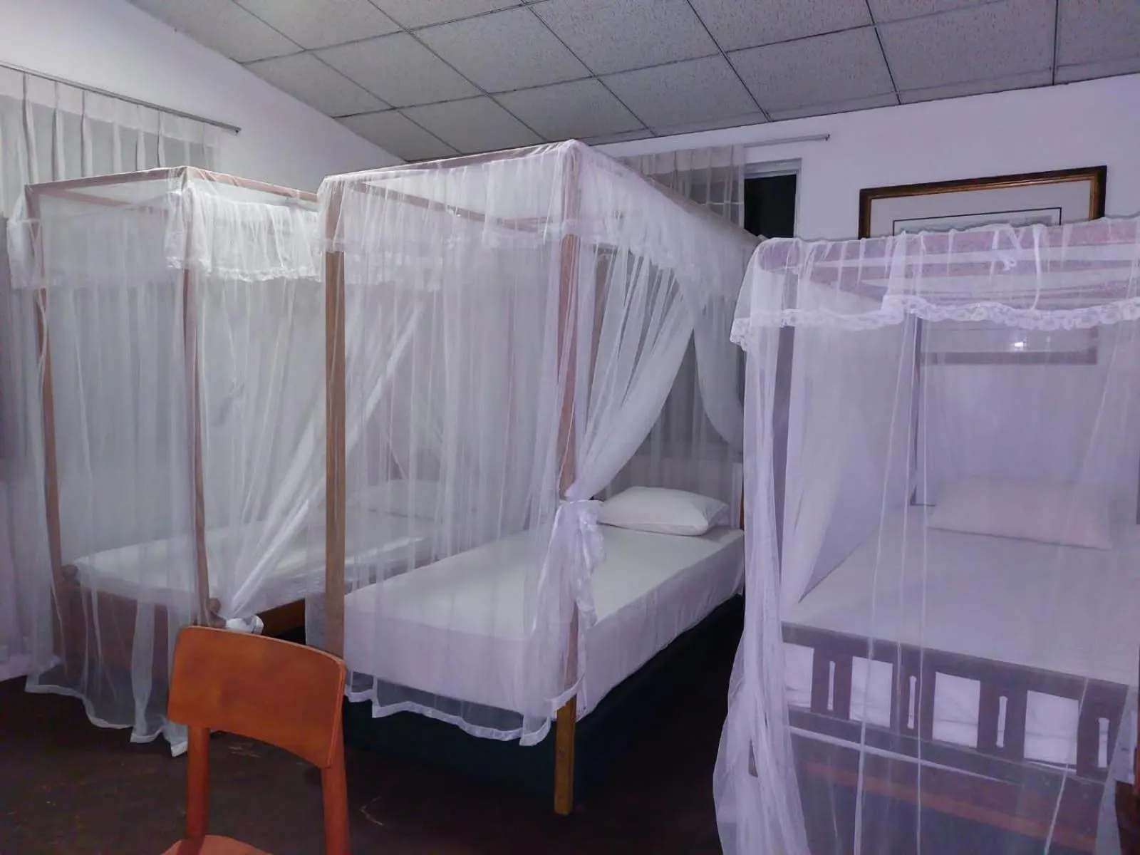 Bed in Blue Horizon Beach Hotel