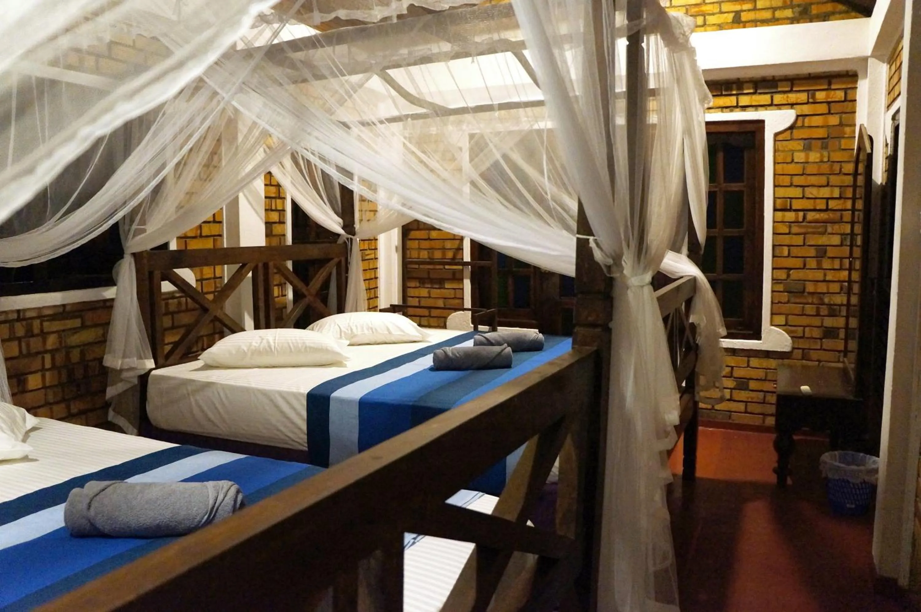 Bed in Blue Horizon Beach Hotel