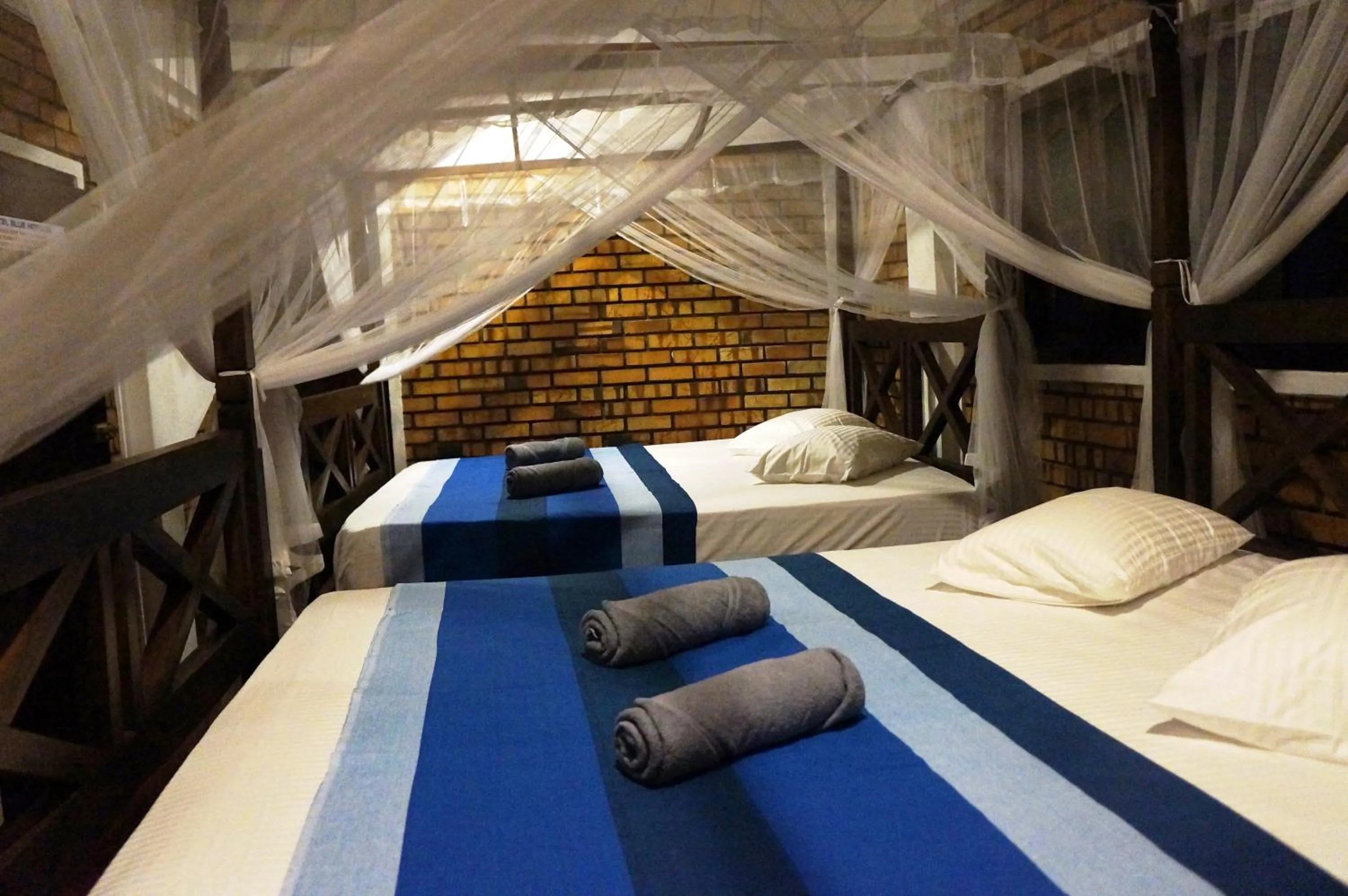 Bed in Blue Horizon Beach Hotel