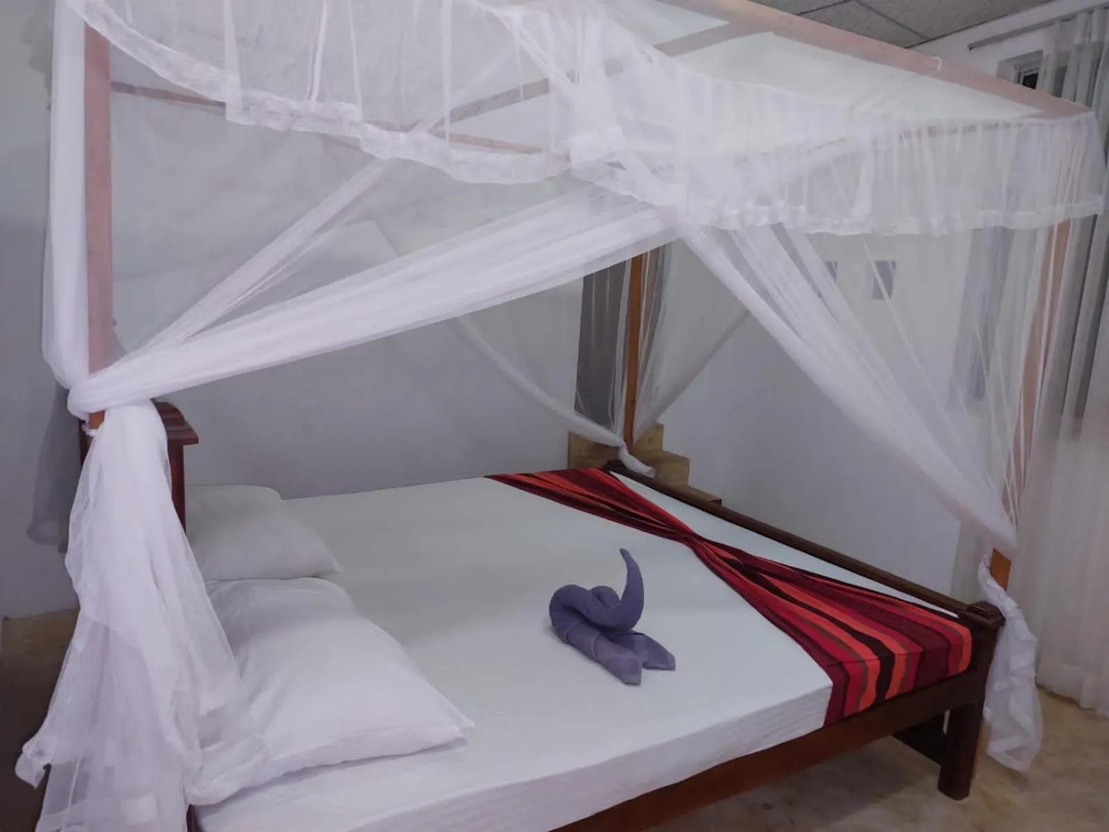 Bed in Blue Horizon Beach Hotel