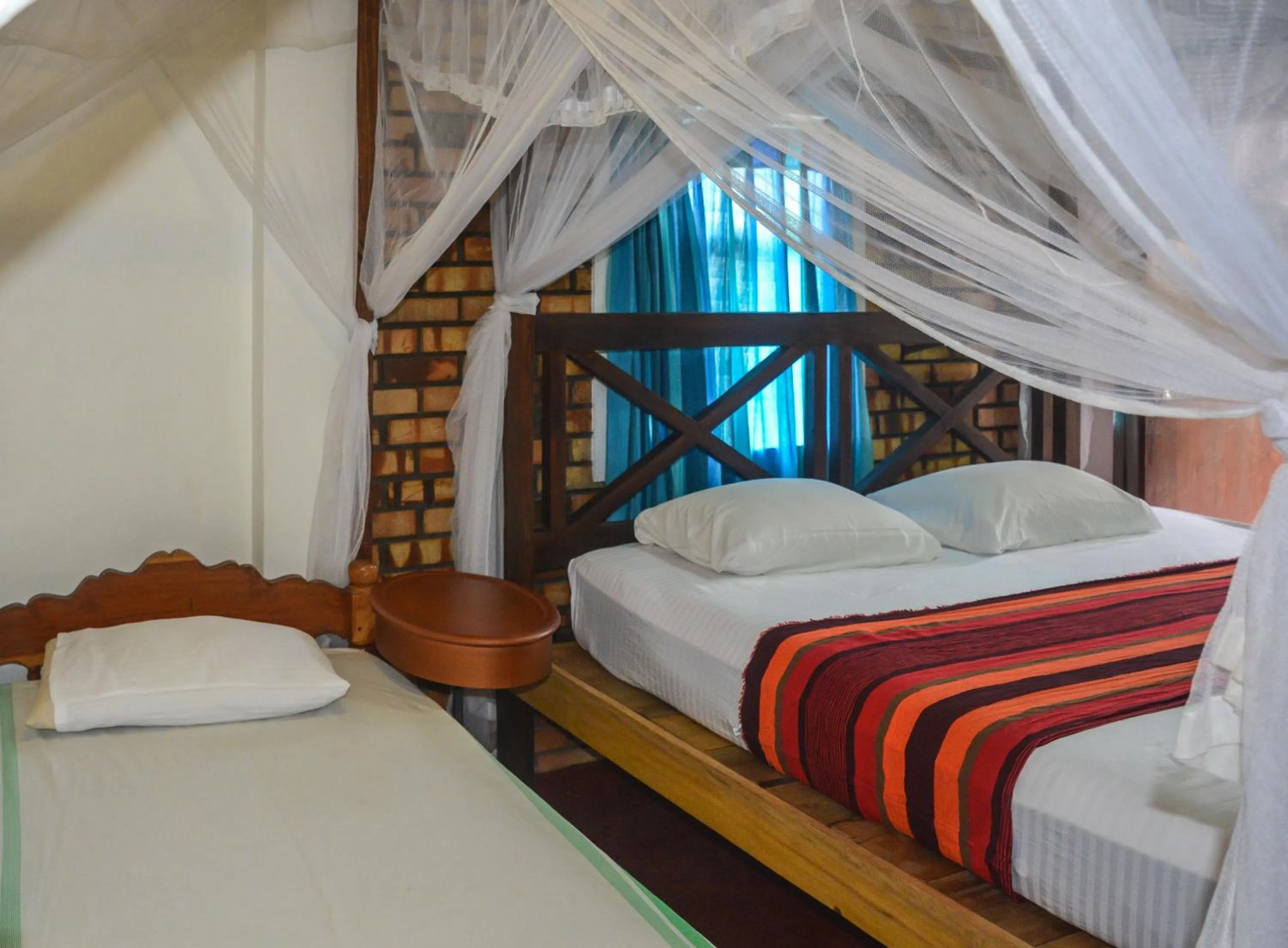 Bed in Blue Horizon Beach Hotel