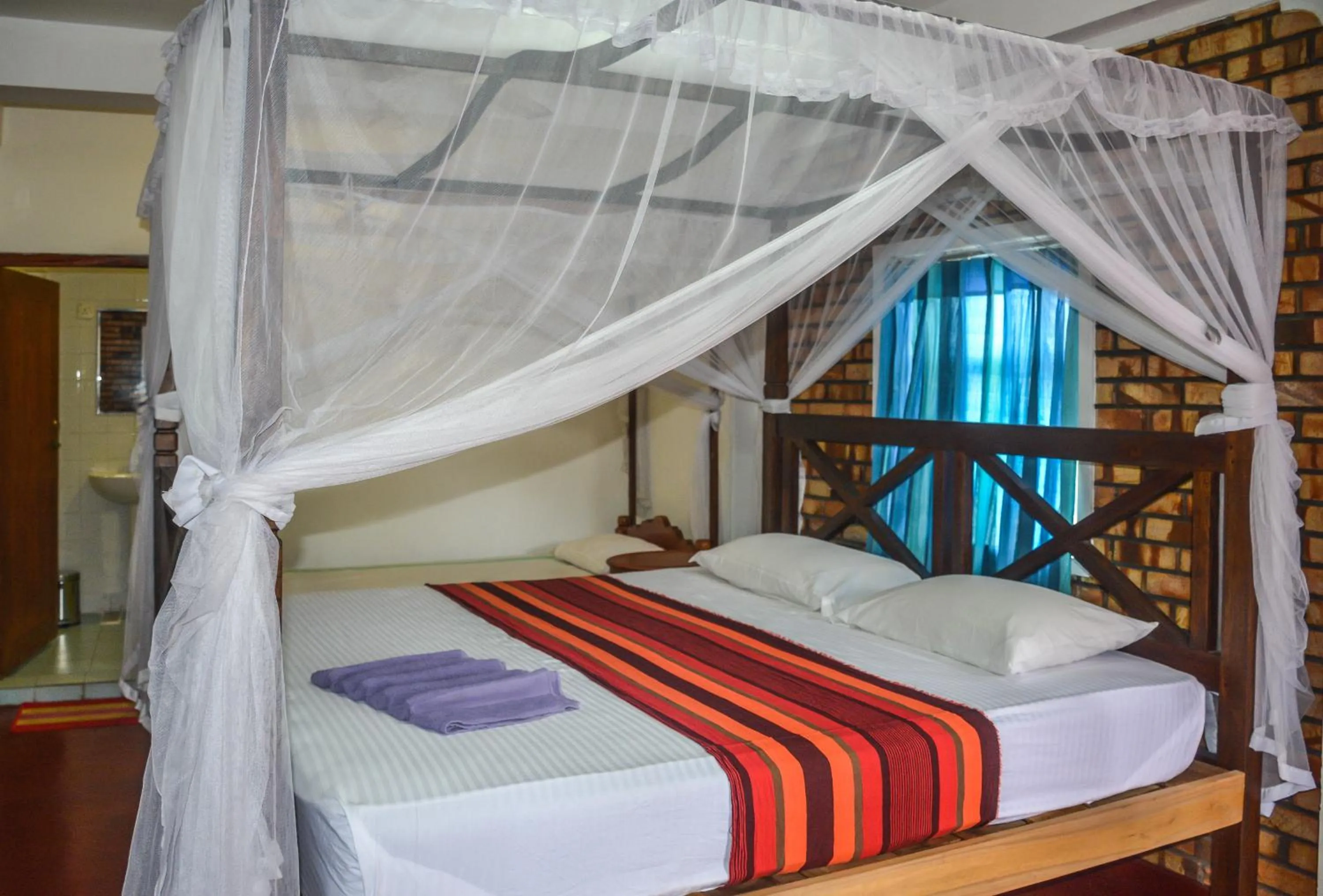 Bed in Blue Horizon Beach Hotel