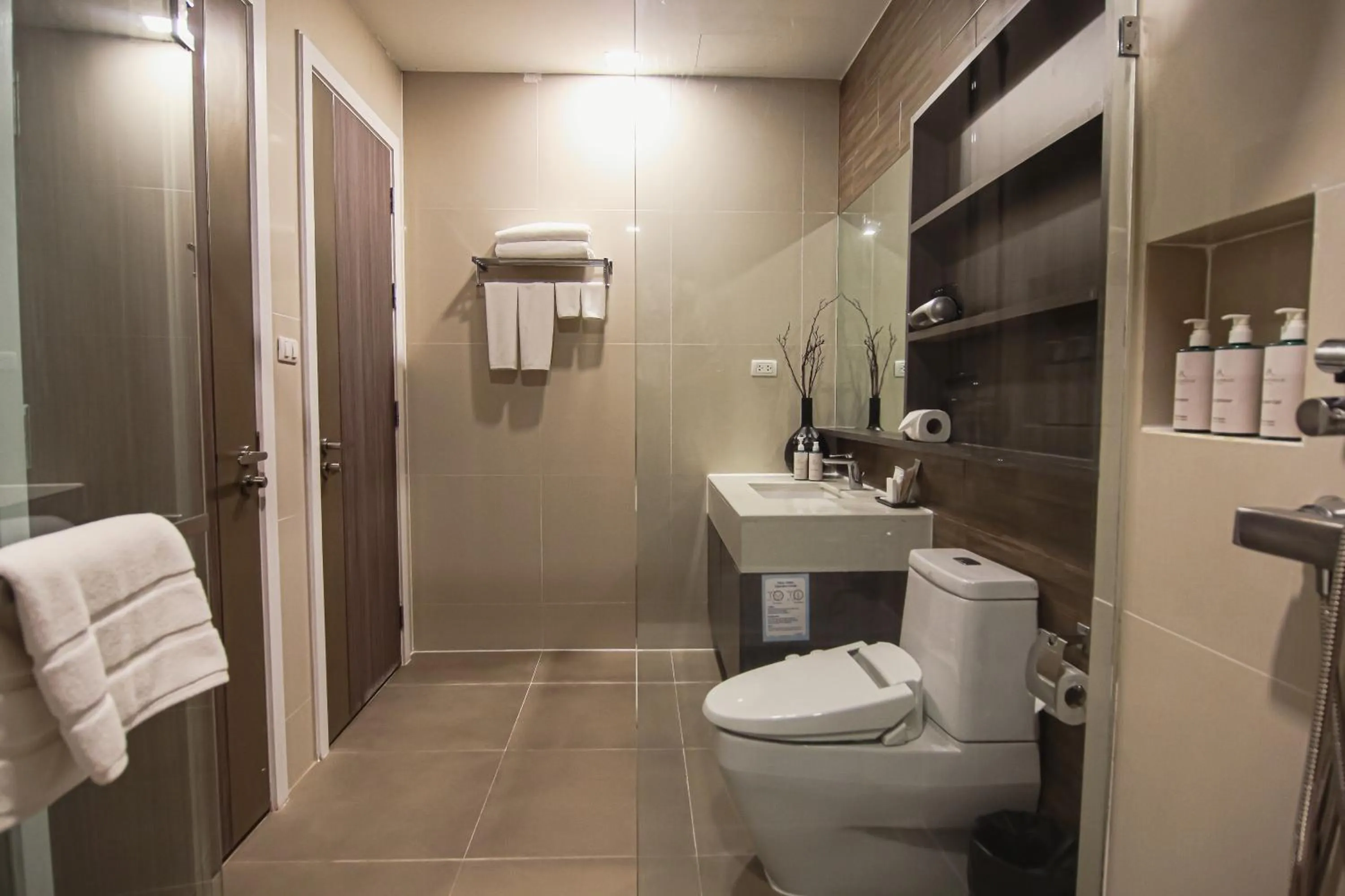 Toilet in Metropolis Suites Bangkok, Tapestry Collection by Hilton