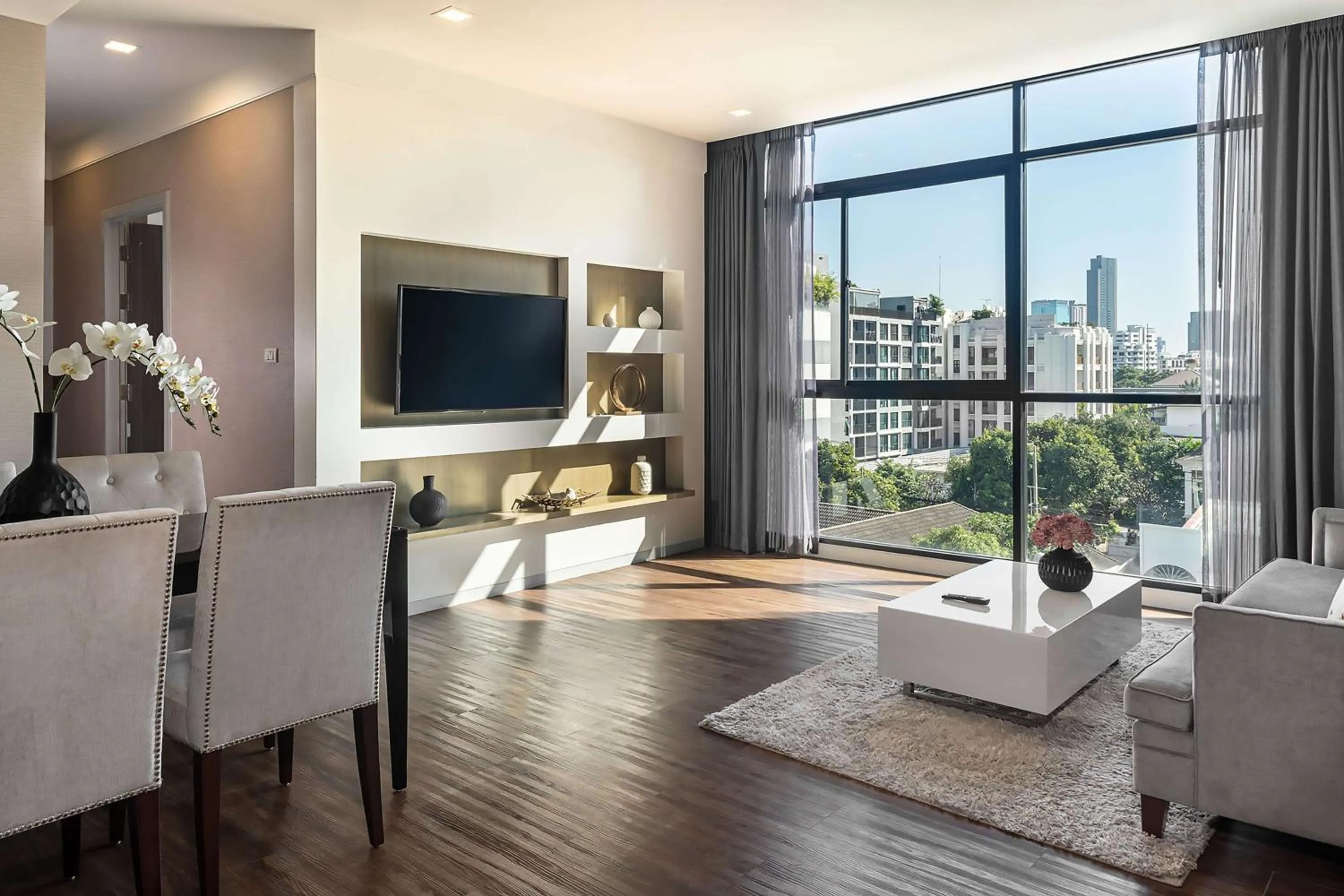 Living room in Metropolis Suites Bangkok, Tapestry Collection by Hilton