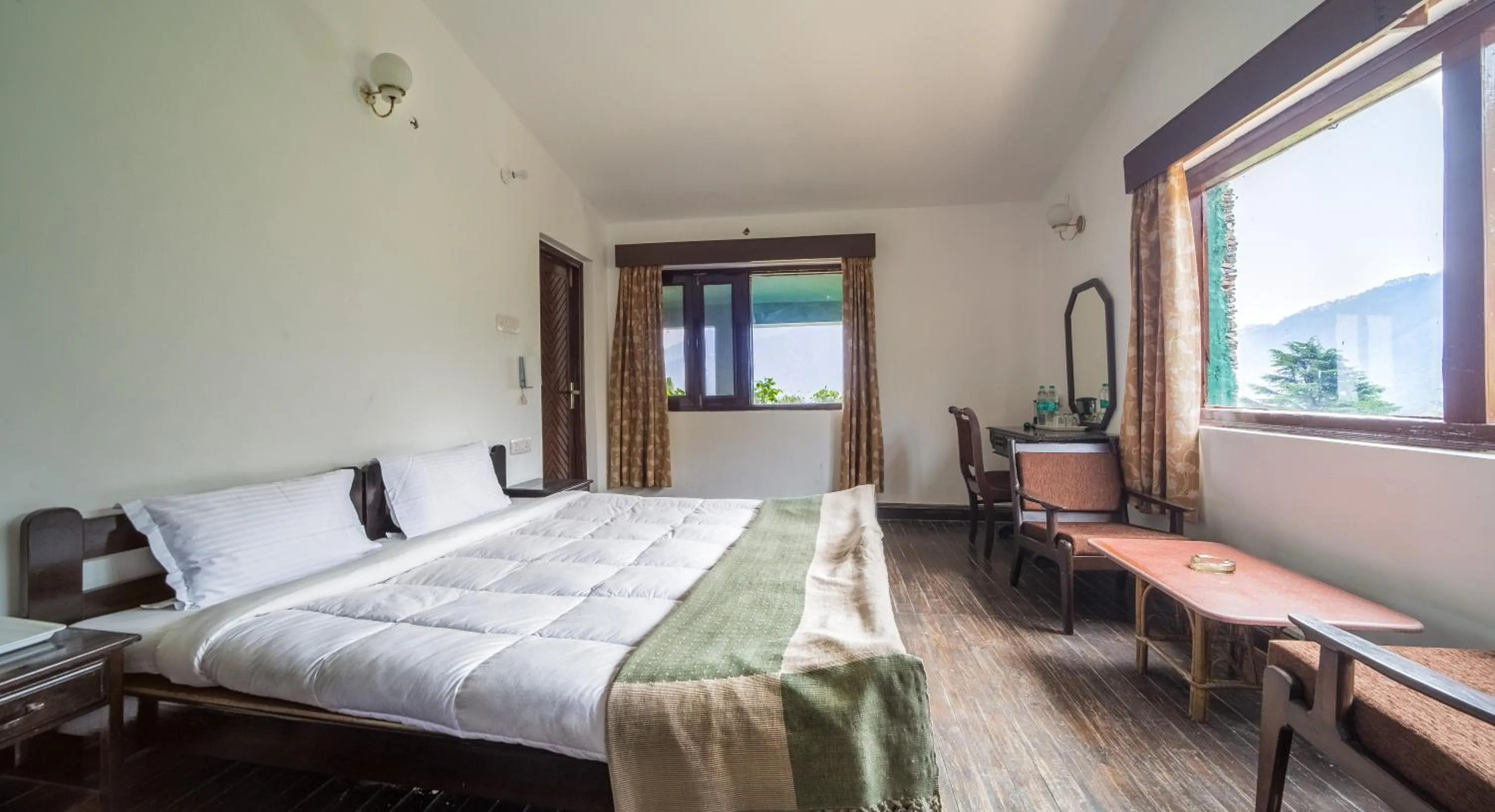 Photo of the whole room, Bed in Cedar Lodge By Aahma