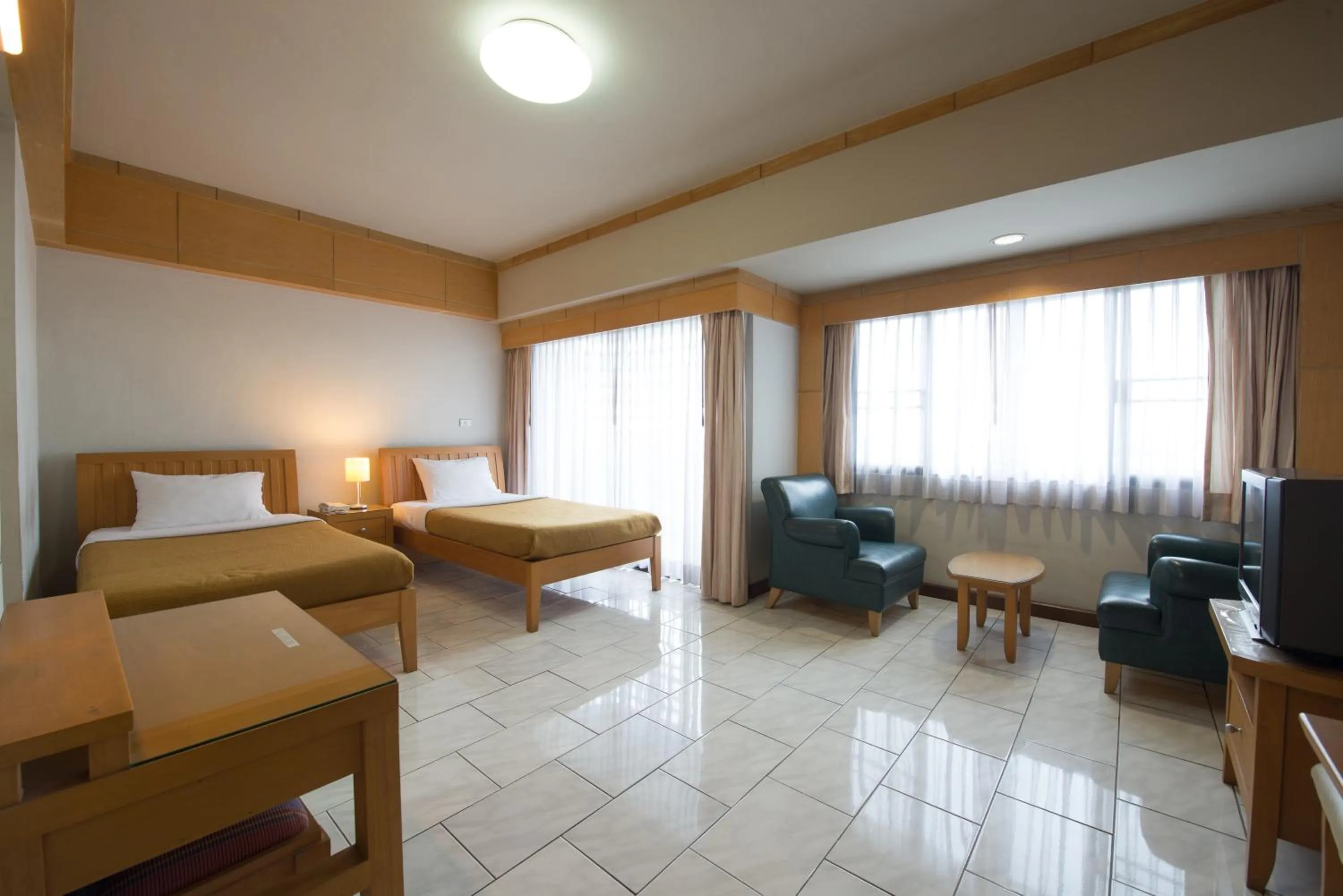 Seating area, Bed in Baan Pratoom