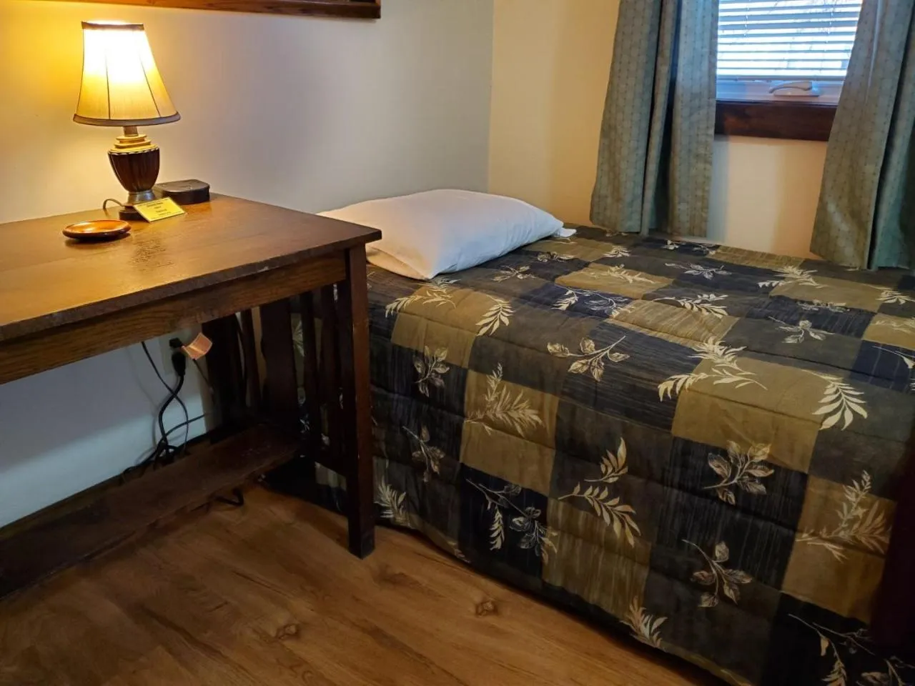 Bed in Little River Inn Motel