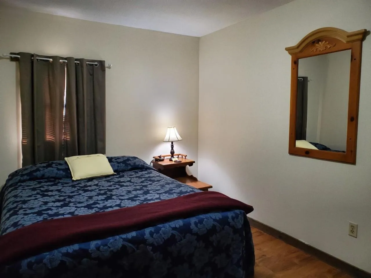 Bed in Little River Inn Motel