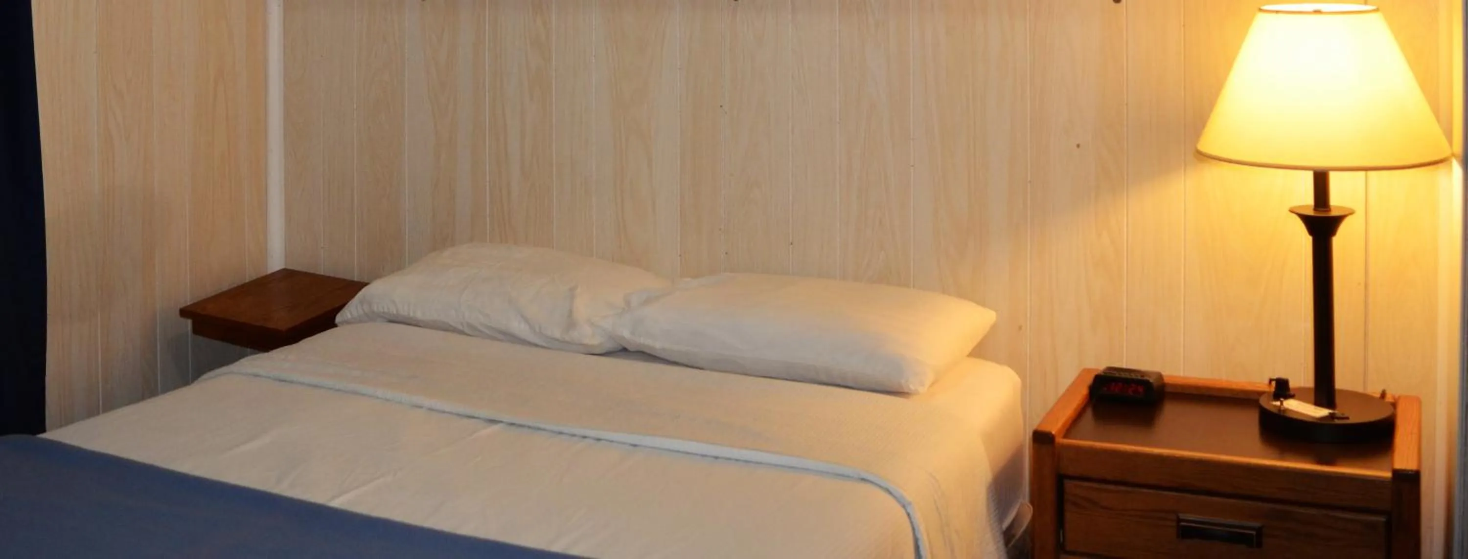 Bed in Little River Inn Motel