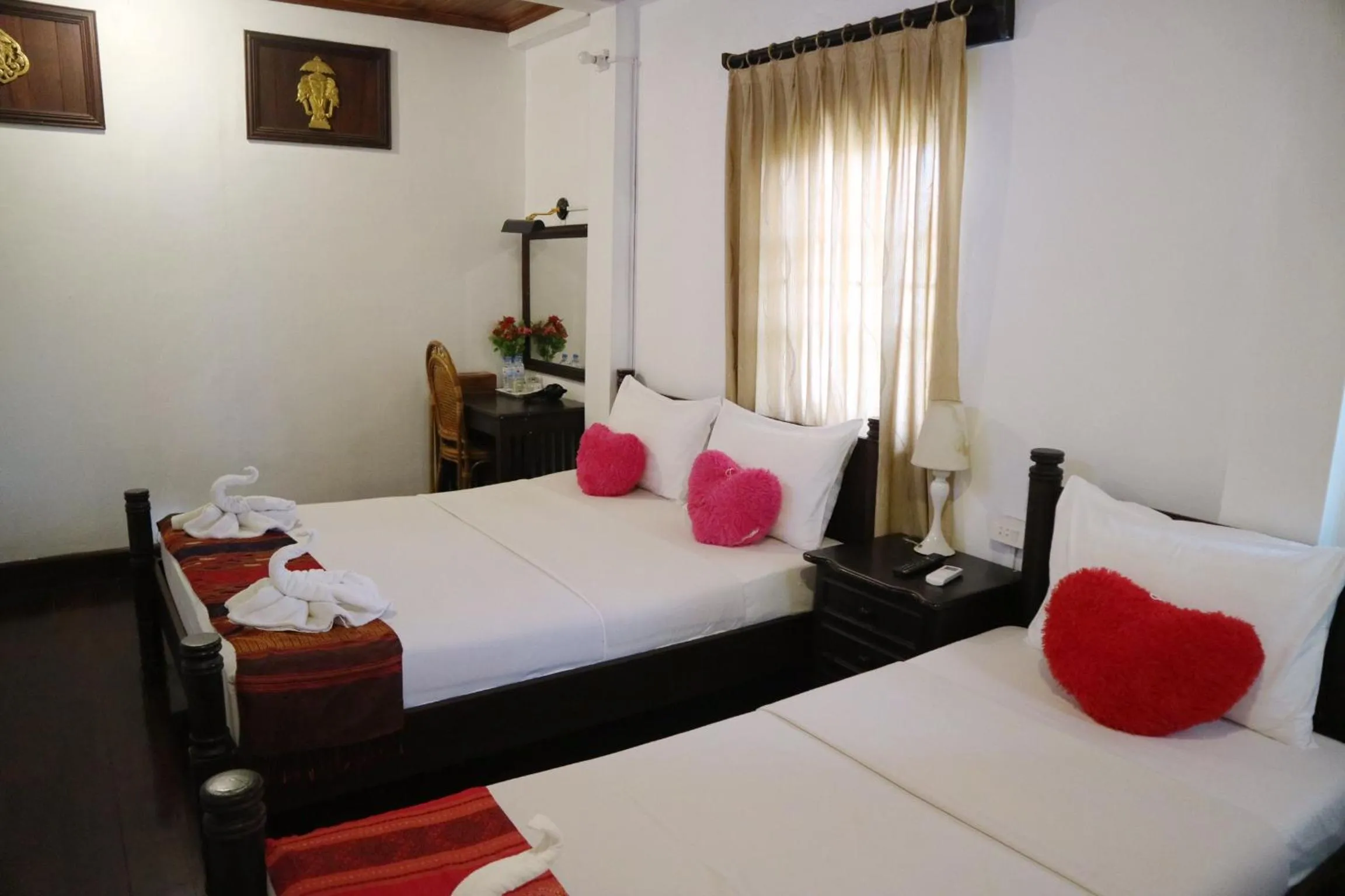 Bed in Villa Senesouk Luang Prabang