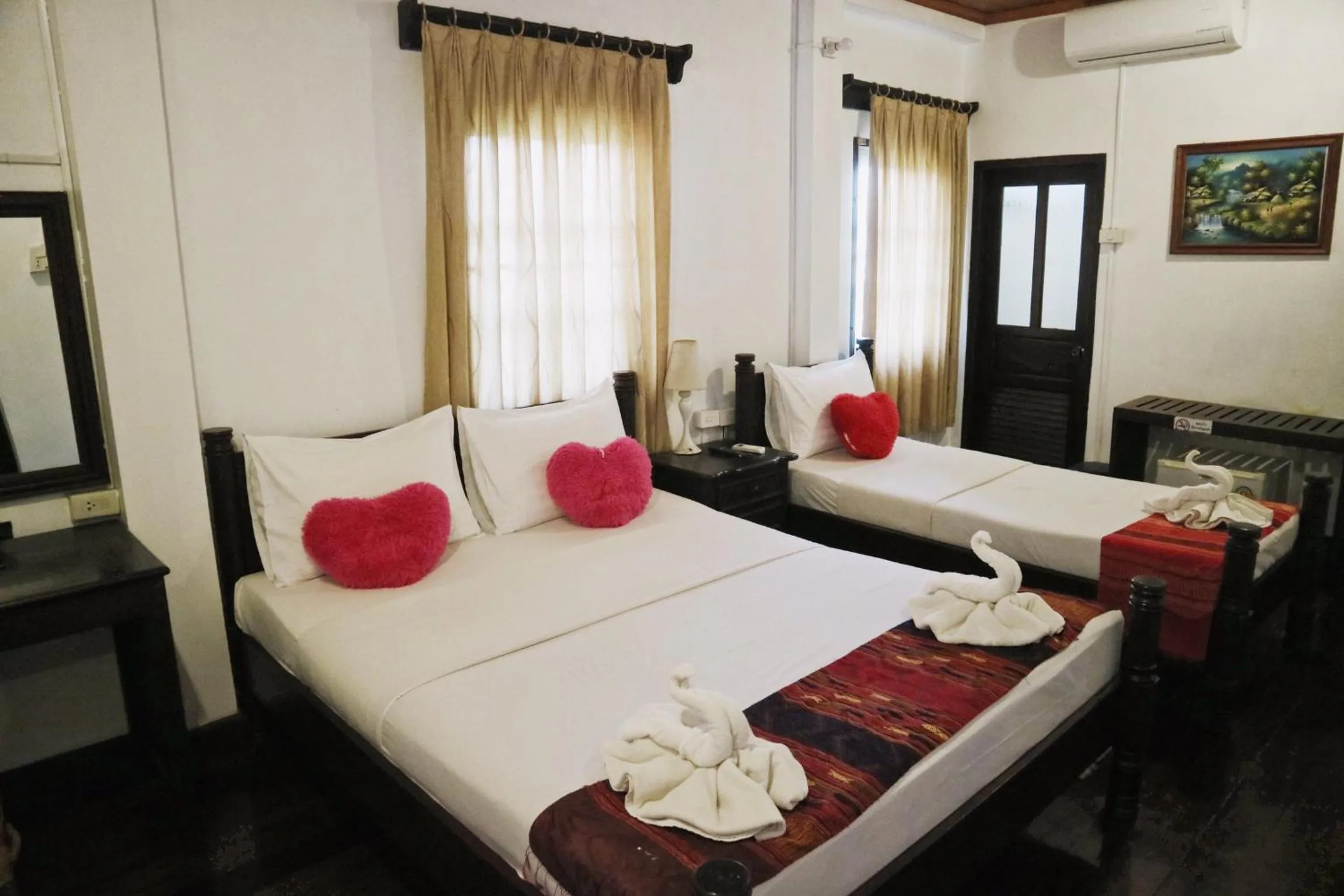 Bed in Villa Senesouk Luang Prabang