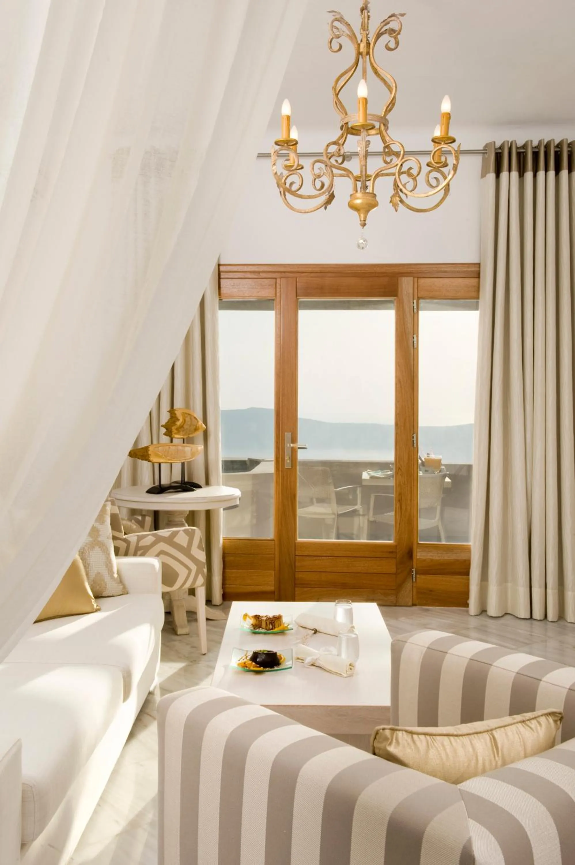 Living room, Bed in Gold Suites - Small Luxury Hotels of the World