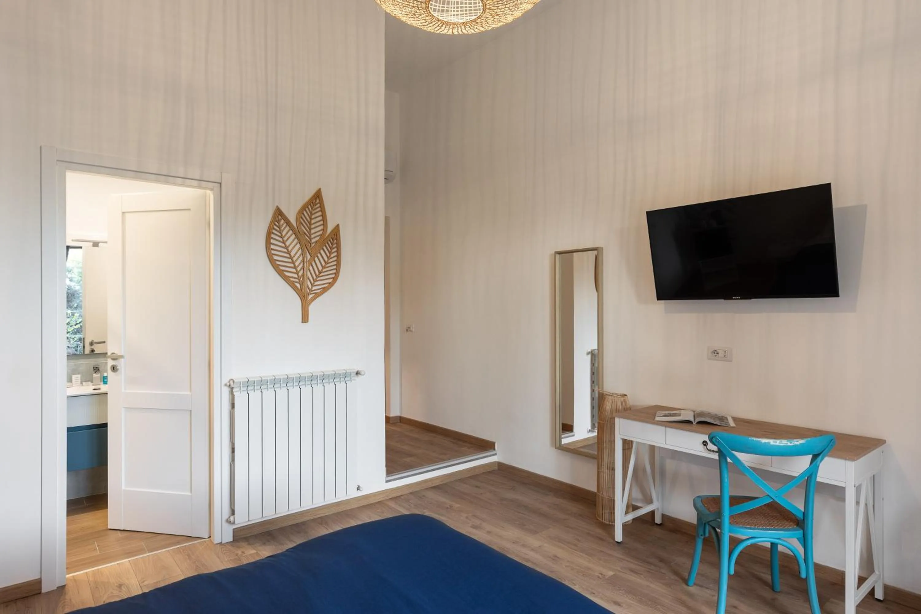 Communal lounge/ TV room in B&B Vitruvio Suites