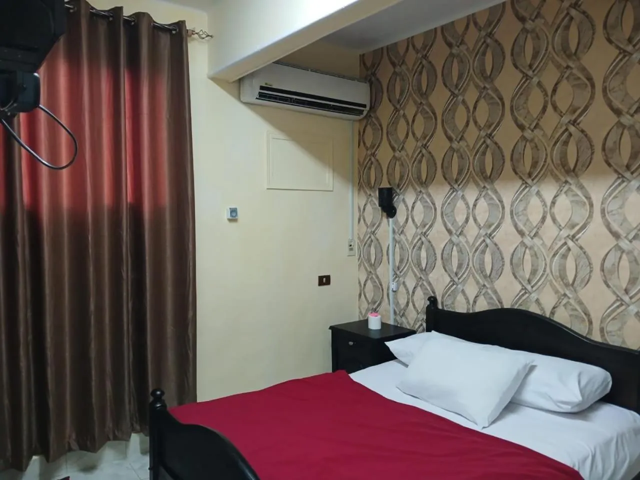 Bed in New Palace Hotel